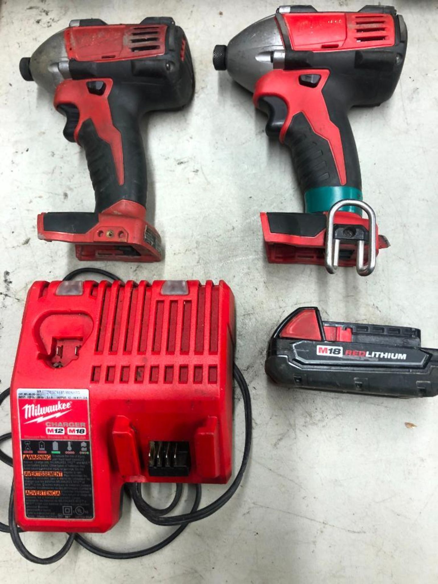 (2) MILWAUKEE CORDLESS IMPACT DRIVERS, W/ (1) BATTERY AND  CHARGER