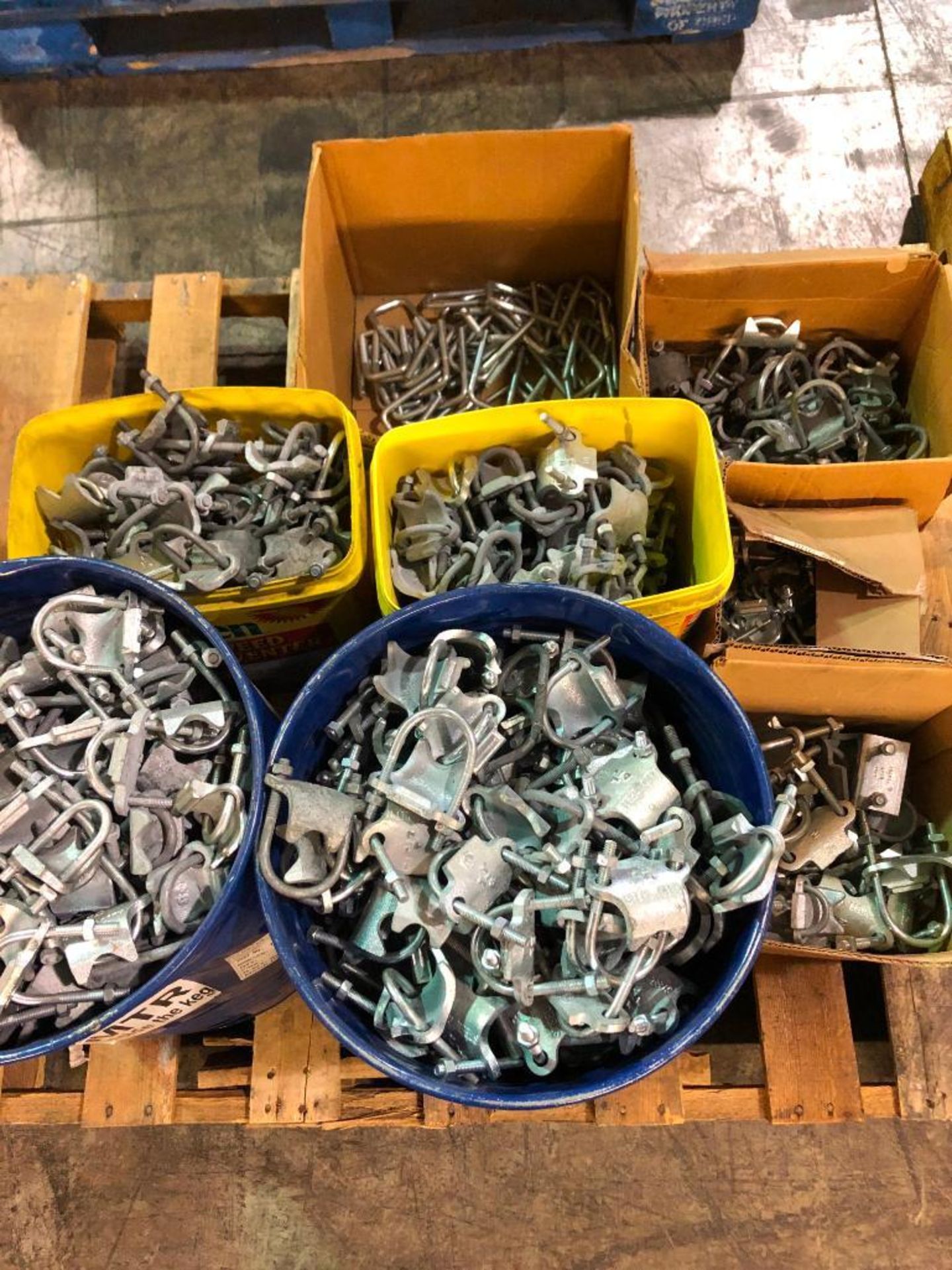 SKID OF ASSORTED SIZE CONDUIT CLAMPS