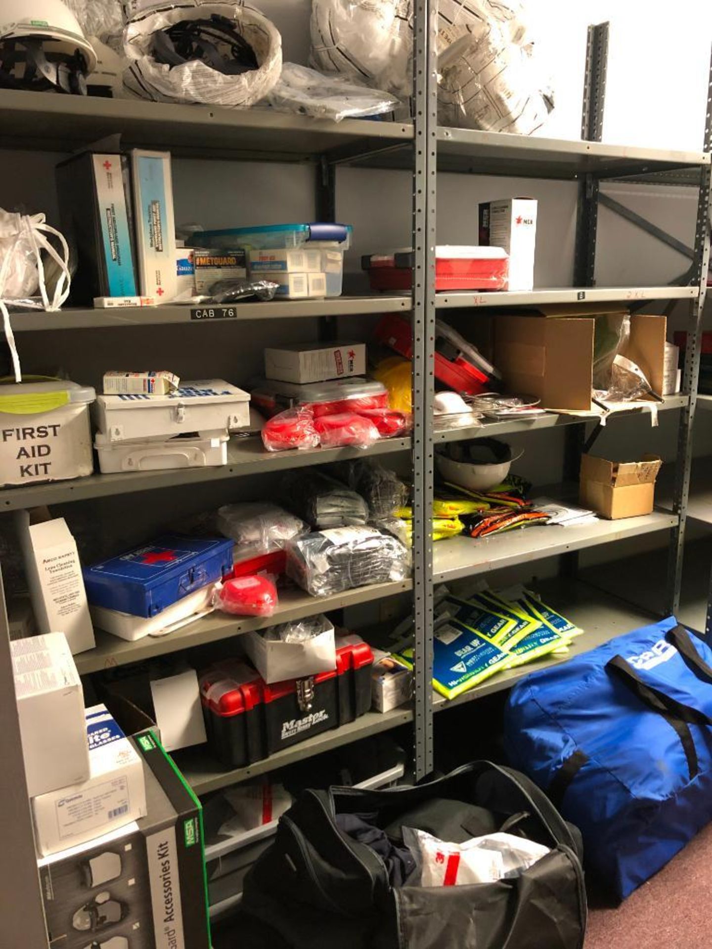 (2) SHELVES AND CONTENT: HARD HATS, FIRST AID KITS, SAFETY VEST, CPR DUMMY, MASKS, GLOVES, SAFETY GL