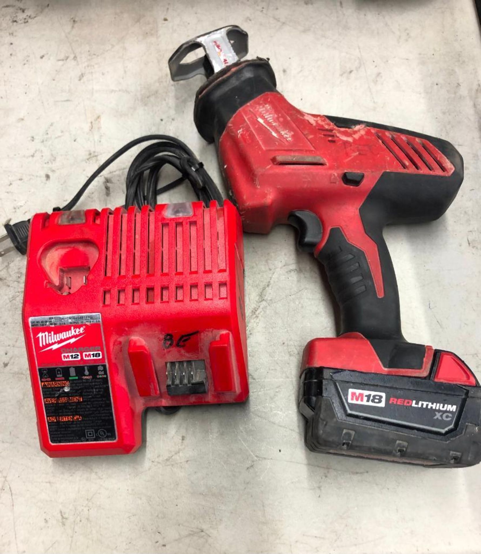 MILWAUKEE CORDLESS HACK SAW, S/N C41DD153001986, W/ (1) BATTERY AND CHARGER