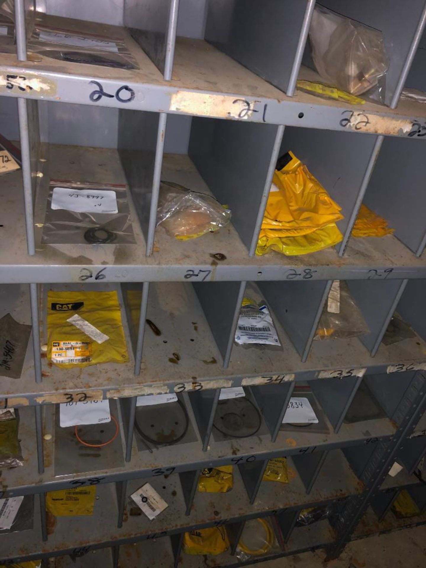 (5) ROWS OF SHELVES W/ DIVIDERS & PIGEON HOLES, SOME CONSISTING OF NEW CATERPILLAR SURPLUS - Image 8 of 25