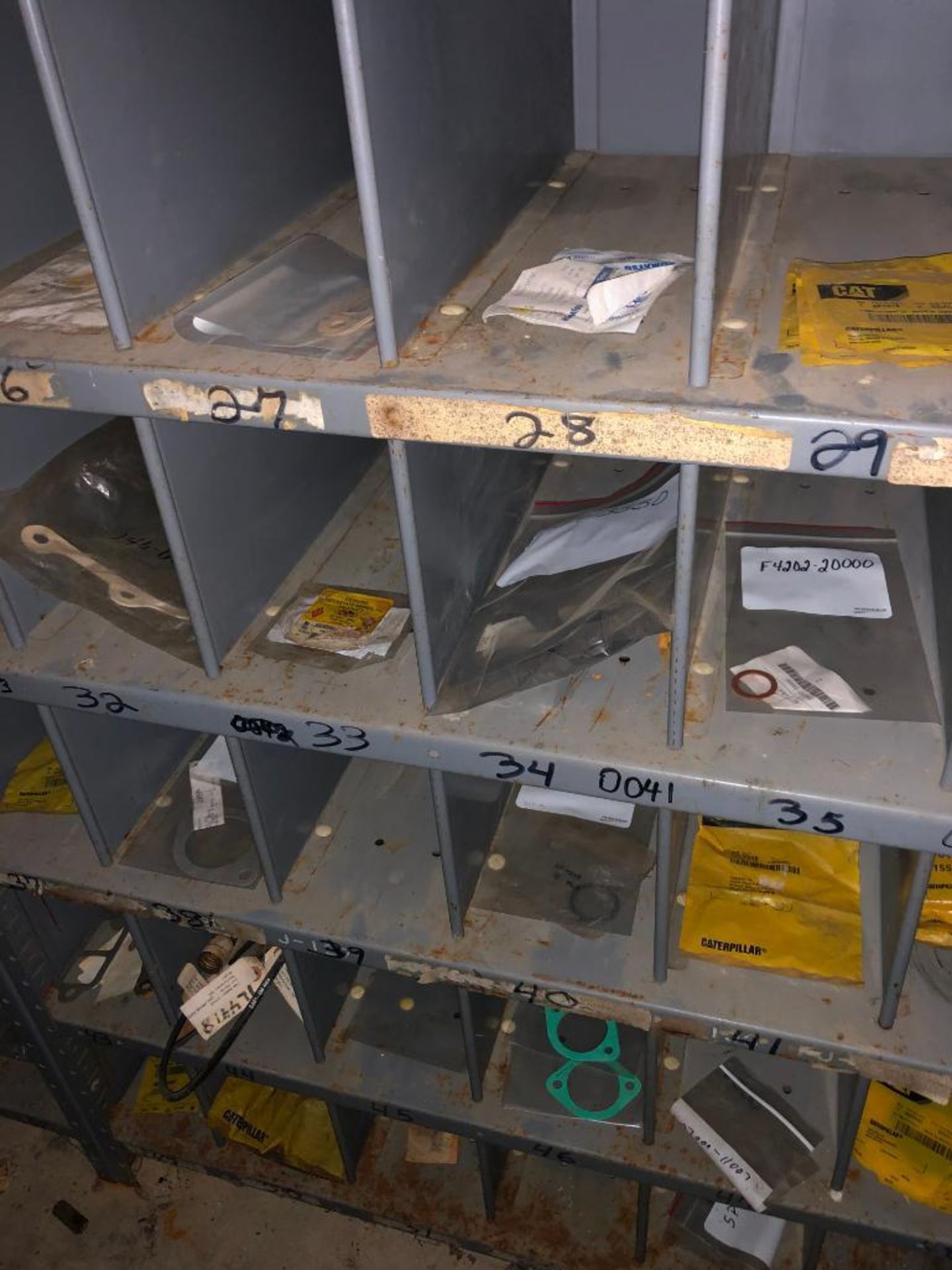 (5) ROWS OF SHELVES W/ DIVIDERS & PIGEON HOLES, SOME CONSISTING OF NEW CATERPILLAR SURPLUS - Image 7 of 25