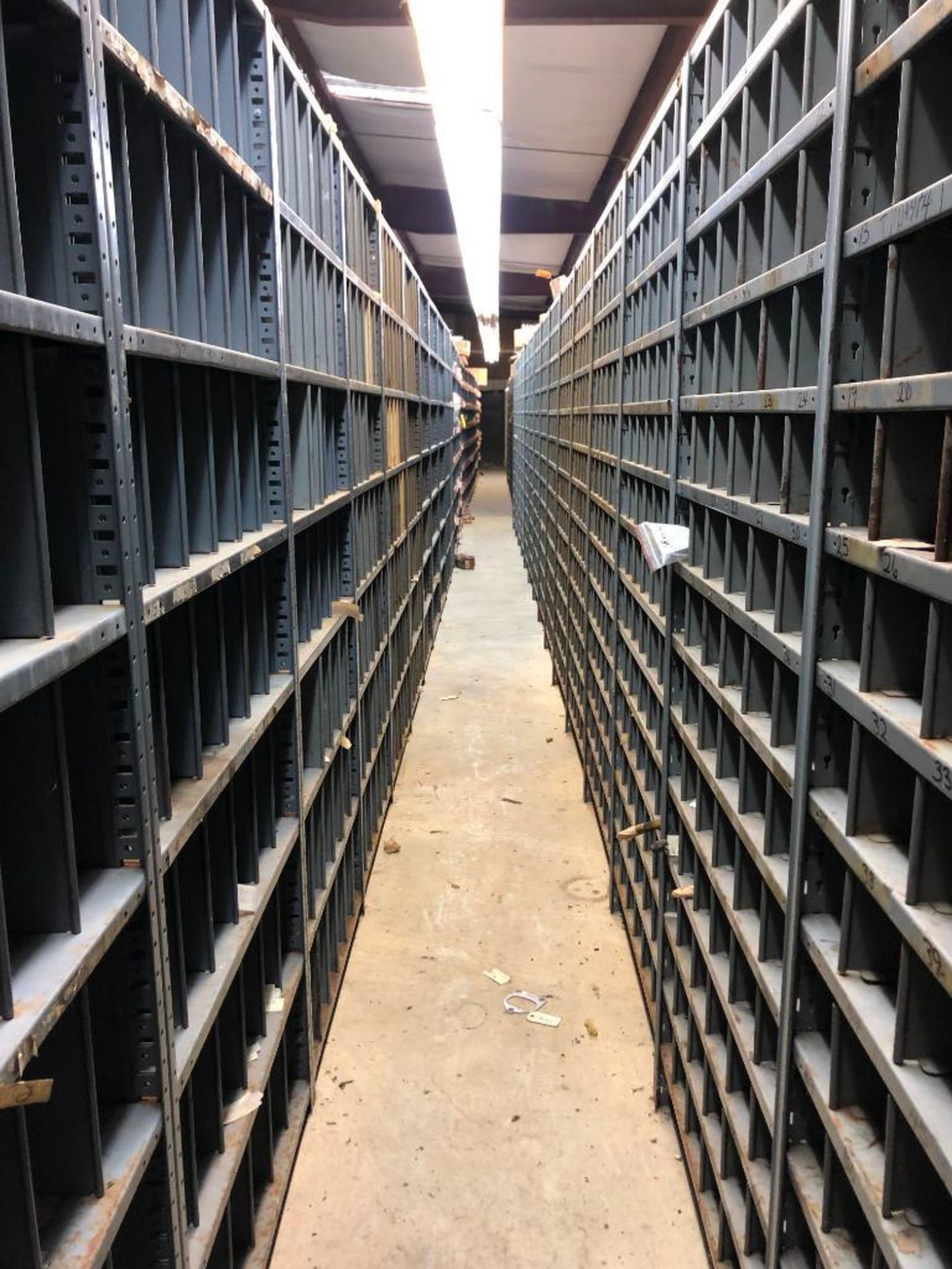 (5) ROWS OF SHELVES W/ DIVIDERS & PIGEON HOLES, SOME CONSISTING OF NEW CATERPILLAR SURPLUS - Image 15 of 25