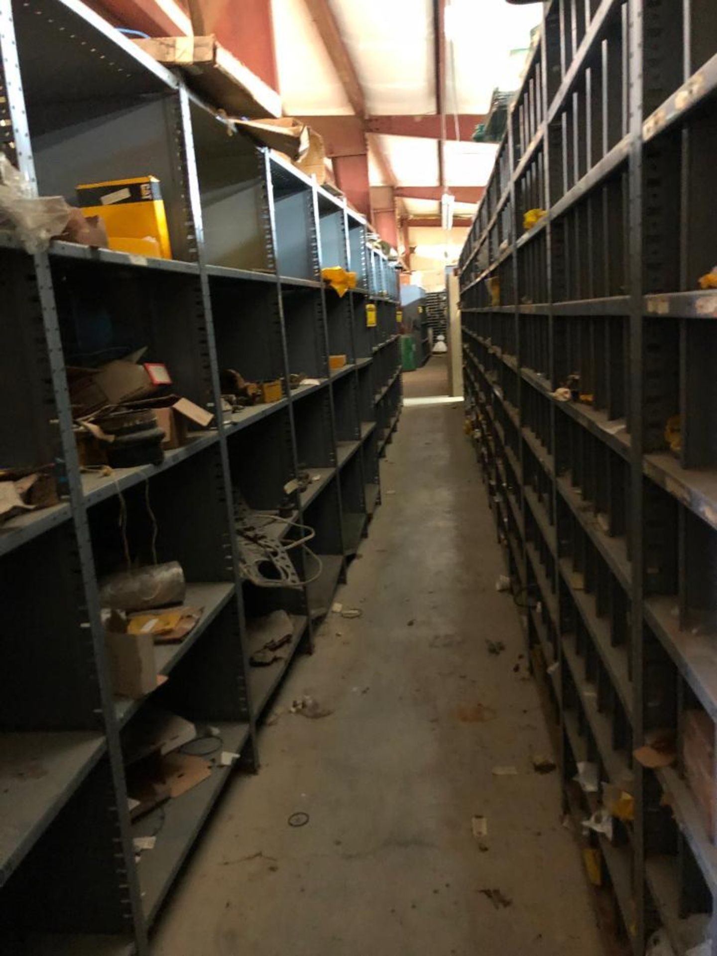 (5) ROWS OF SHELVES W/ DIVIDERS & PIGEON HOLES, SOME CONSISTING OF NEW CATERPILLAR SURPLUS