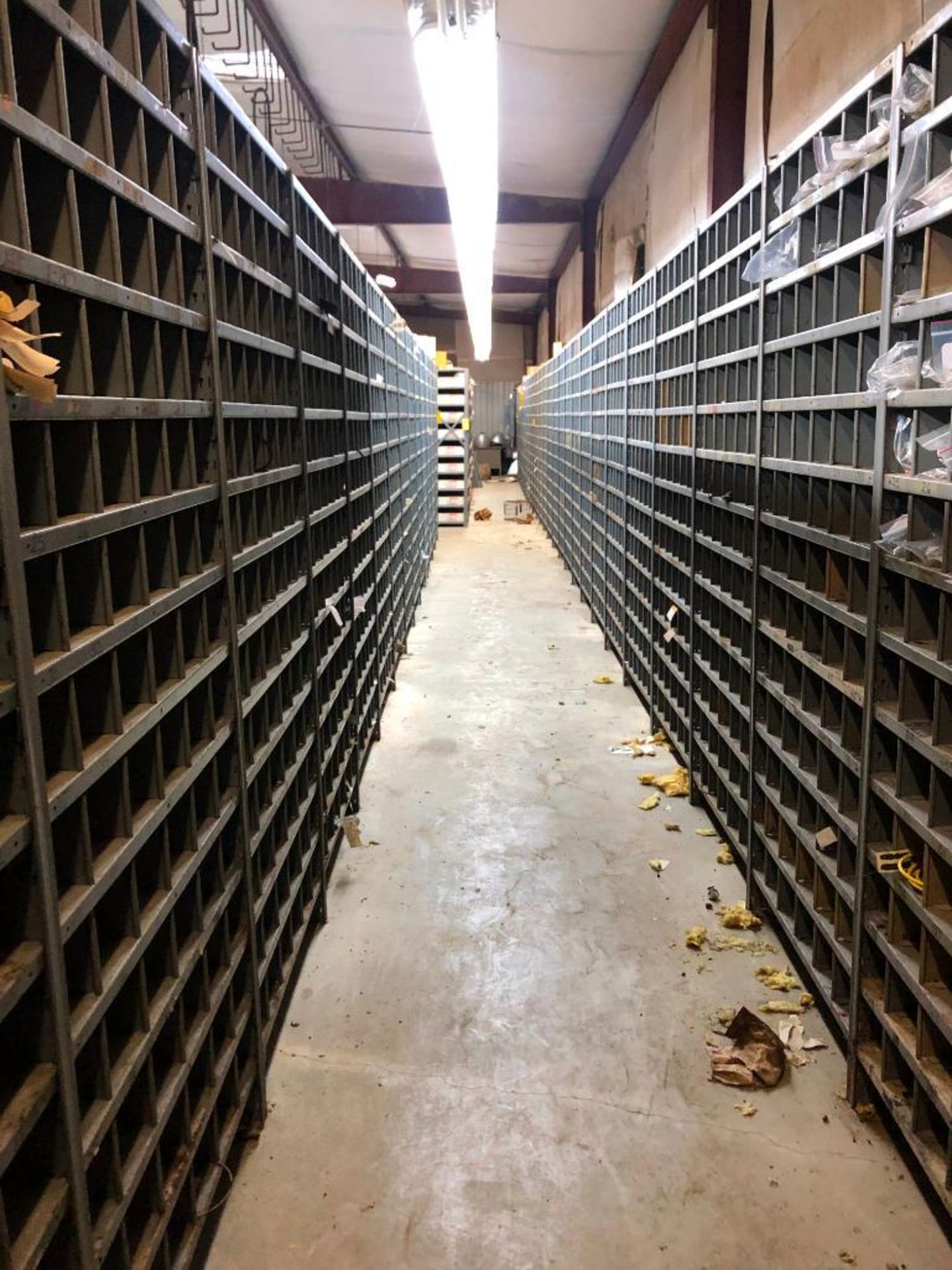 (5) ROWS OF SHELVES W/ DIVIDERS & PIGEON HOLES, SOME CONSISTING OF NEW CATERPILLAR SURPLUS - Image 16 of 25