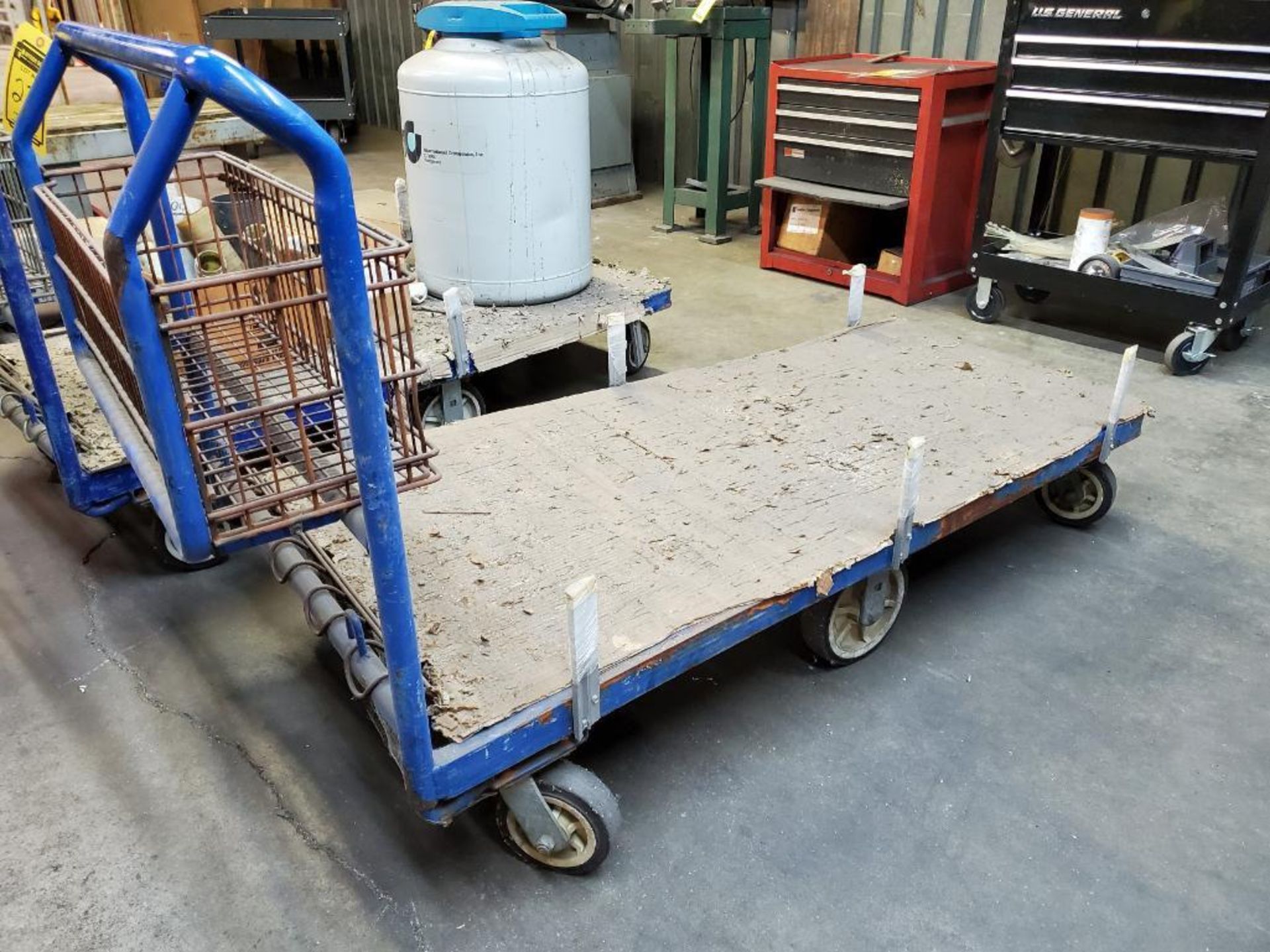 (3) 6-WHEEL MATERIAL FLAT CARTS, W/ STORAGE CAGE