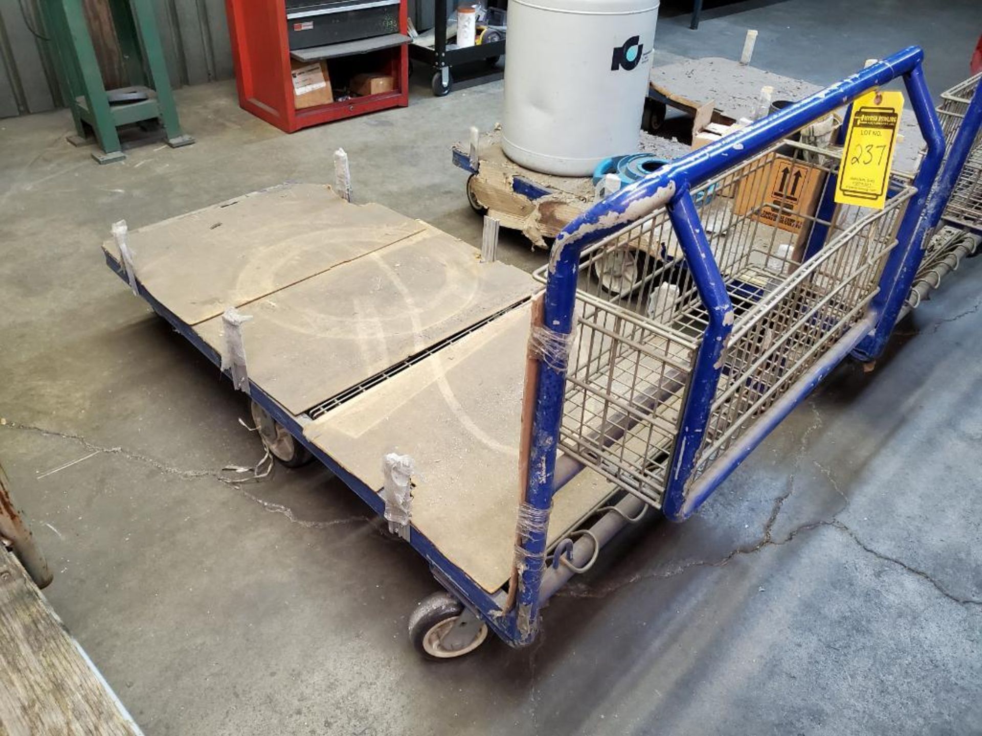 (3) 6-WHEEL MATERIAL FLAT CARTS, W/ STORAGE CAGE