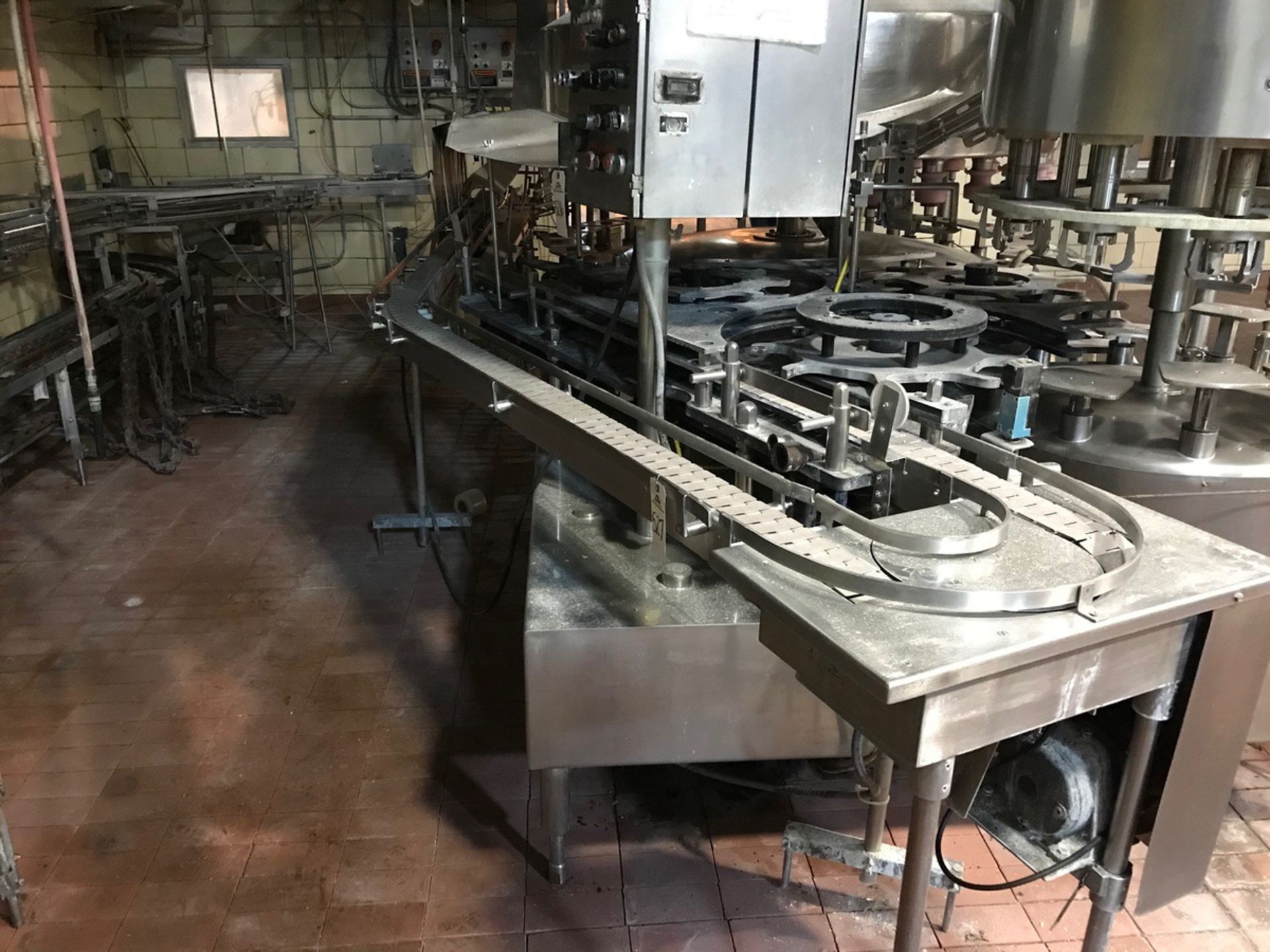 STAINLESS STEEL GALLON JUG CONVEYOR, 180 TURN, APPROXIMATELY 20FTLONG, WITH JUG WAS | Rig Fee $650