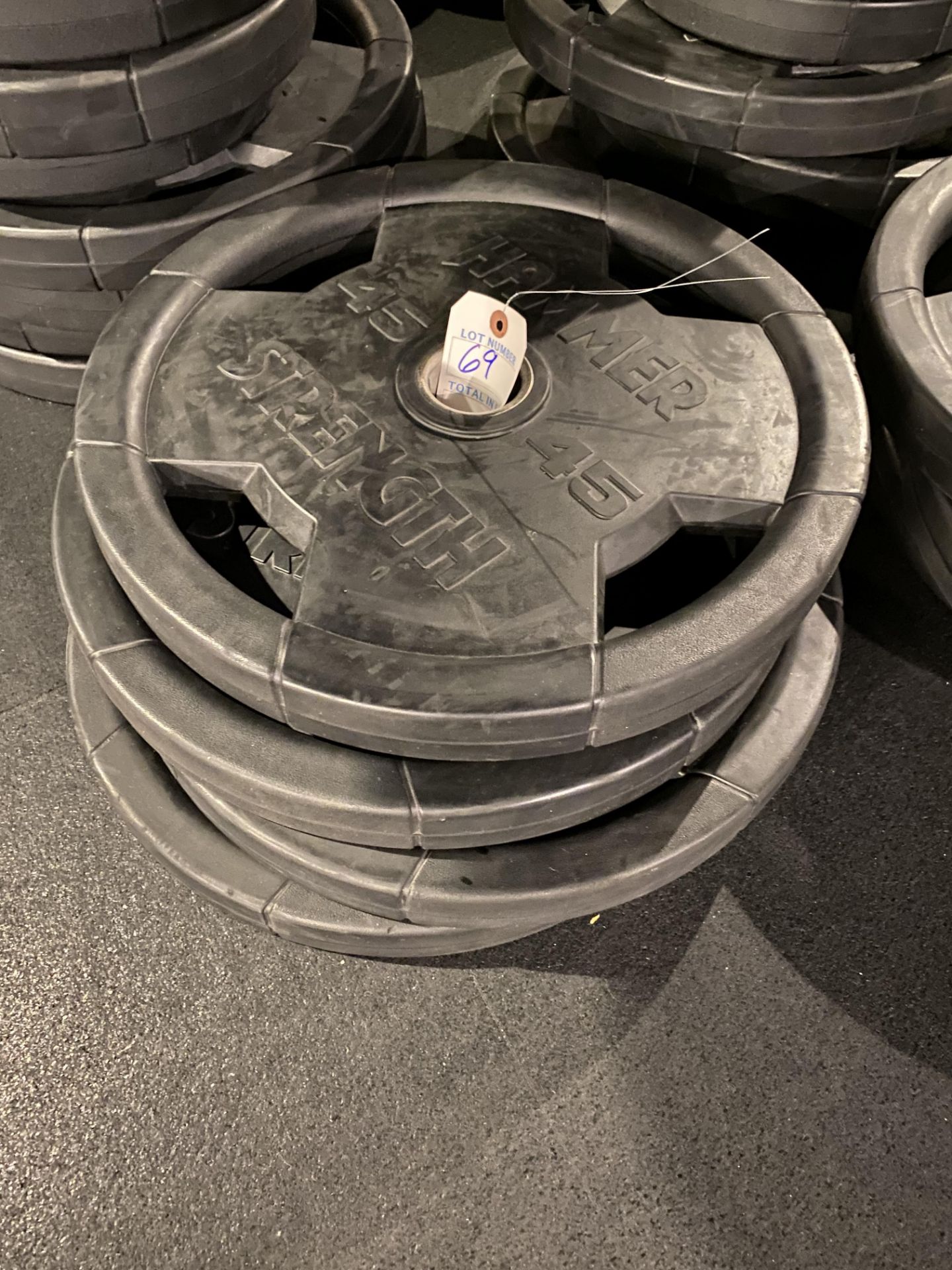 {LOT} (4) 45 Lbs. Plates of Hammer Strength Rubber Coated Weight Plates (180 Lb. Total)