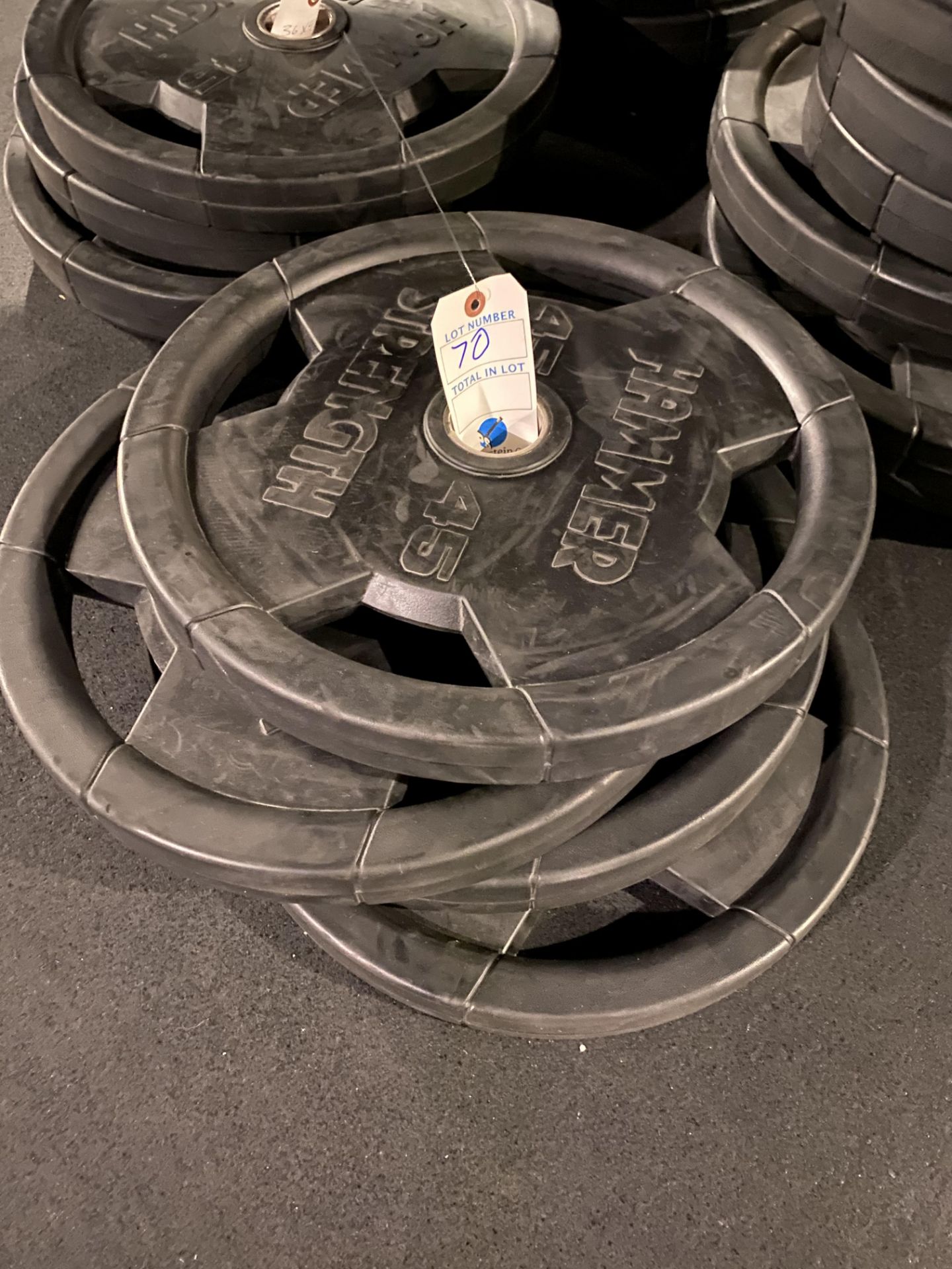 {LOT} (4) 45 Lbs. Plates of Hammer Strength Rubber Coated Weight Plates (180 Lb. Total)