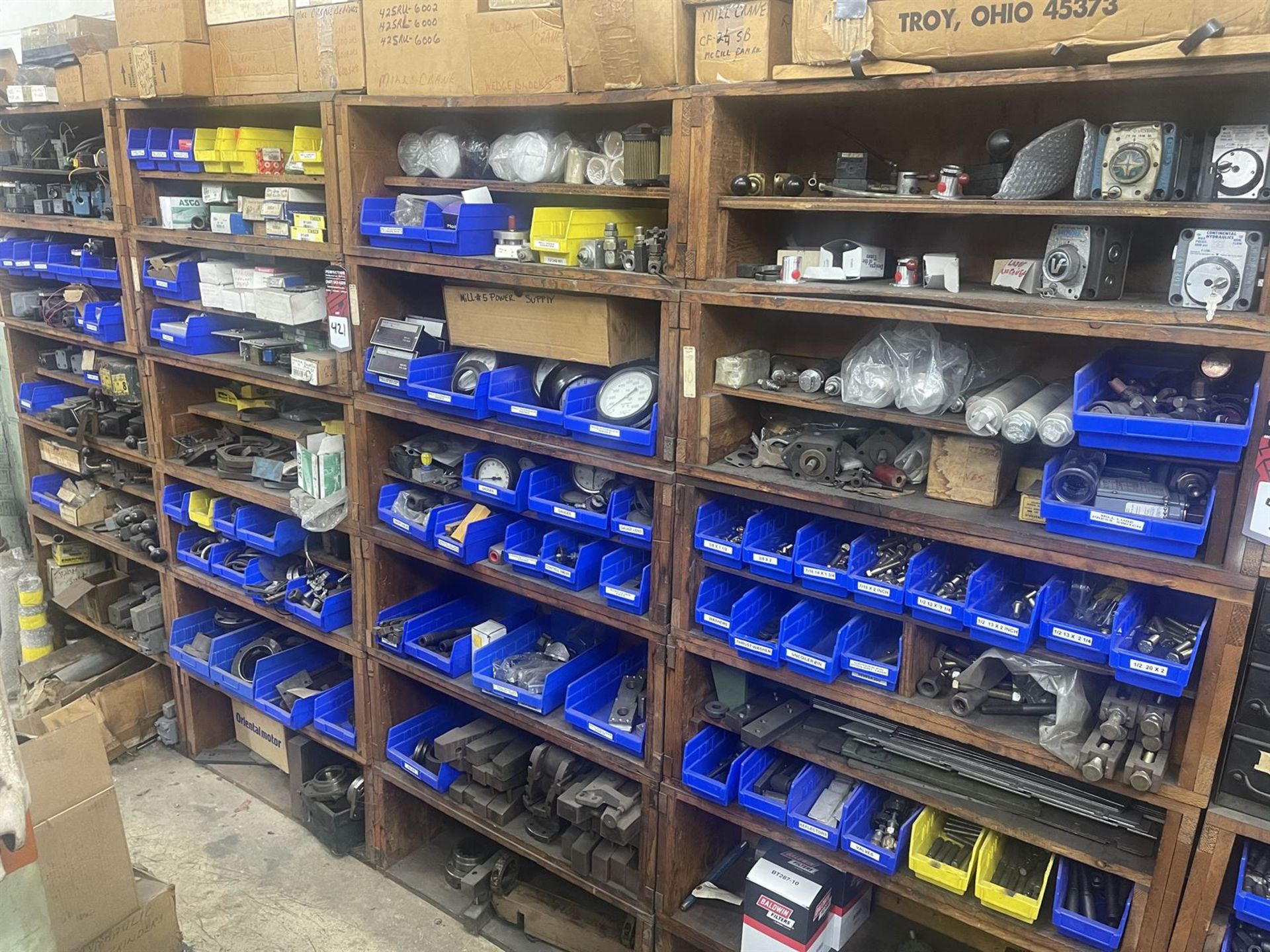 Lot of (4) Shelving Units w/ Assorted mill parts and equipment