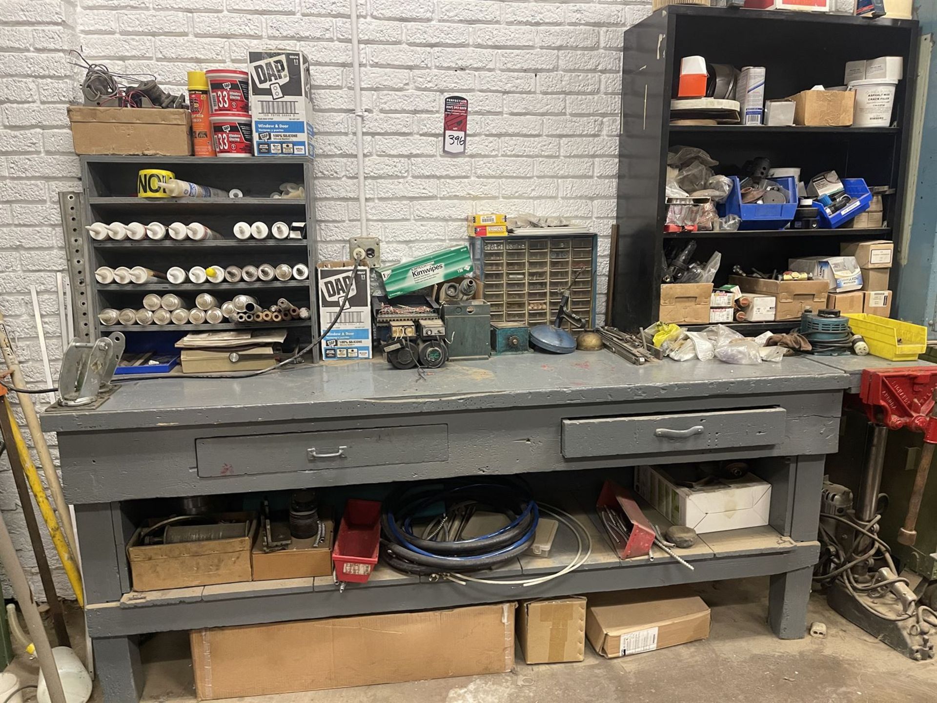 Bench and Shop Cabinet w/ caulk, electronics and Assorted tooling parts