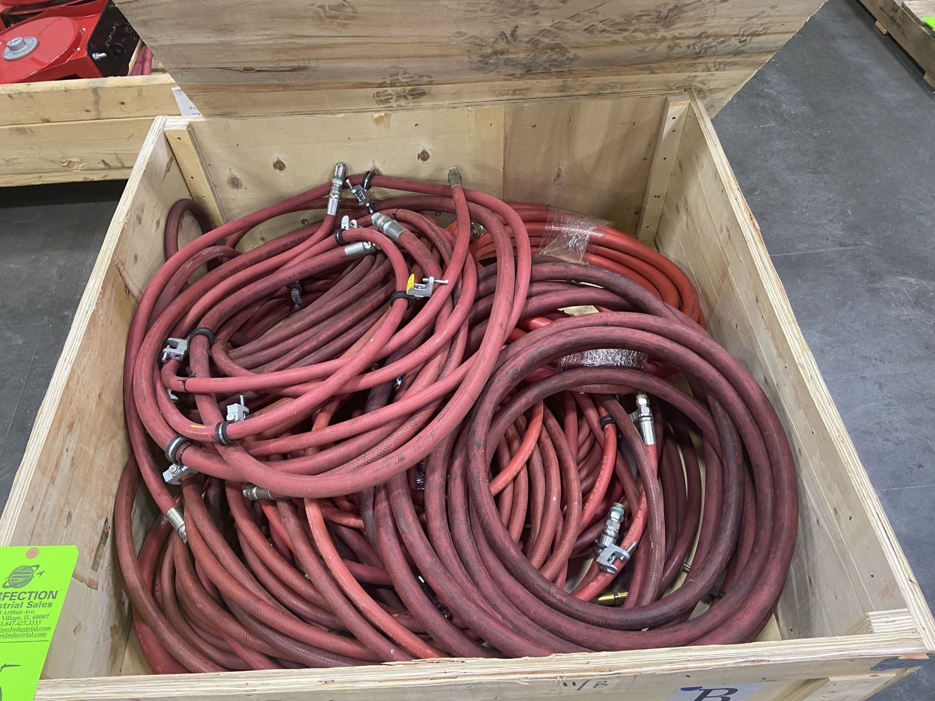 Crate of New and Used Air Hoses