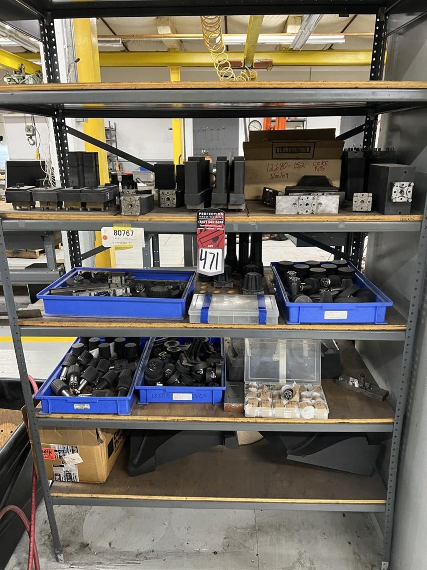 Rack of Assorted EROWA EDM Tooling, Fixtures, and Electrodes