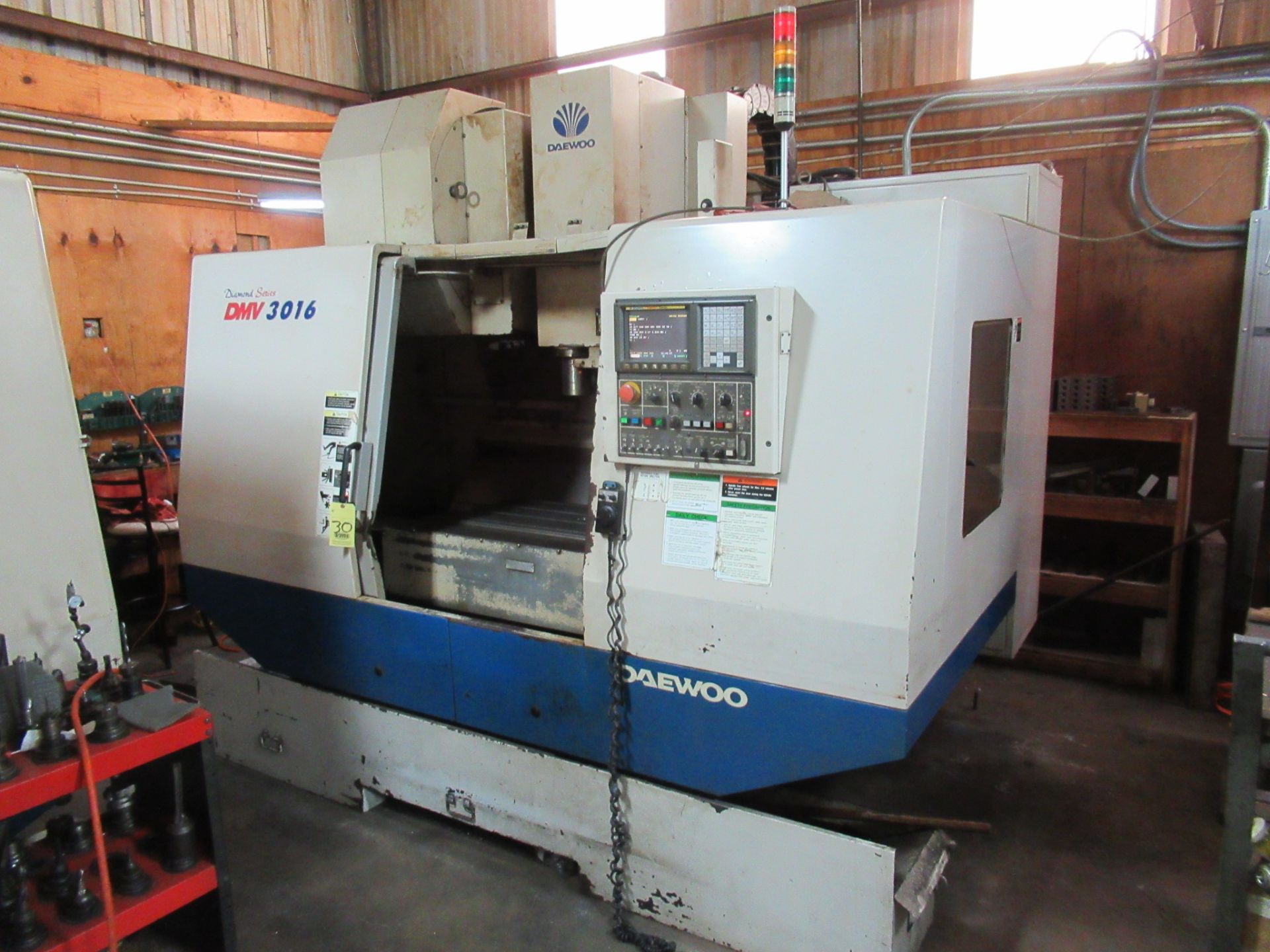 CNC VERTICAL MACHINING CENTER, DAEWOO MDL. DMV3016, new 2003, Fanuc Series i CNC control, 17.7” x