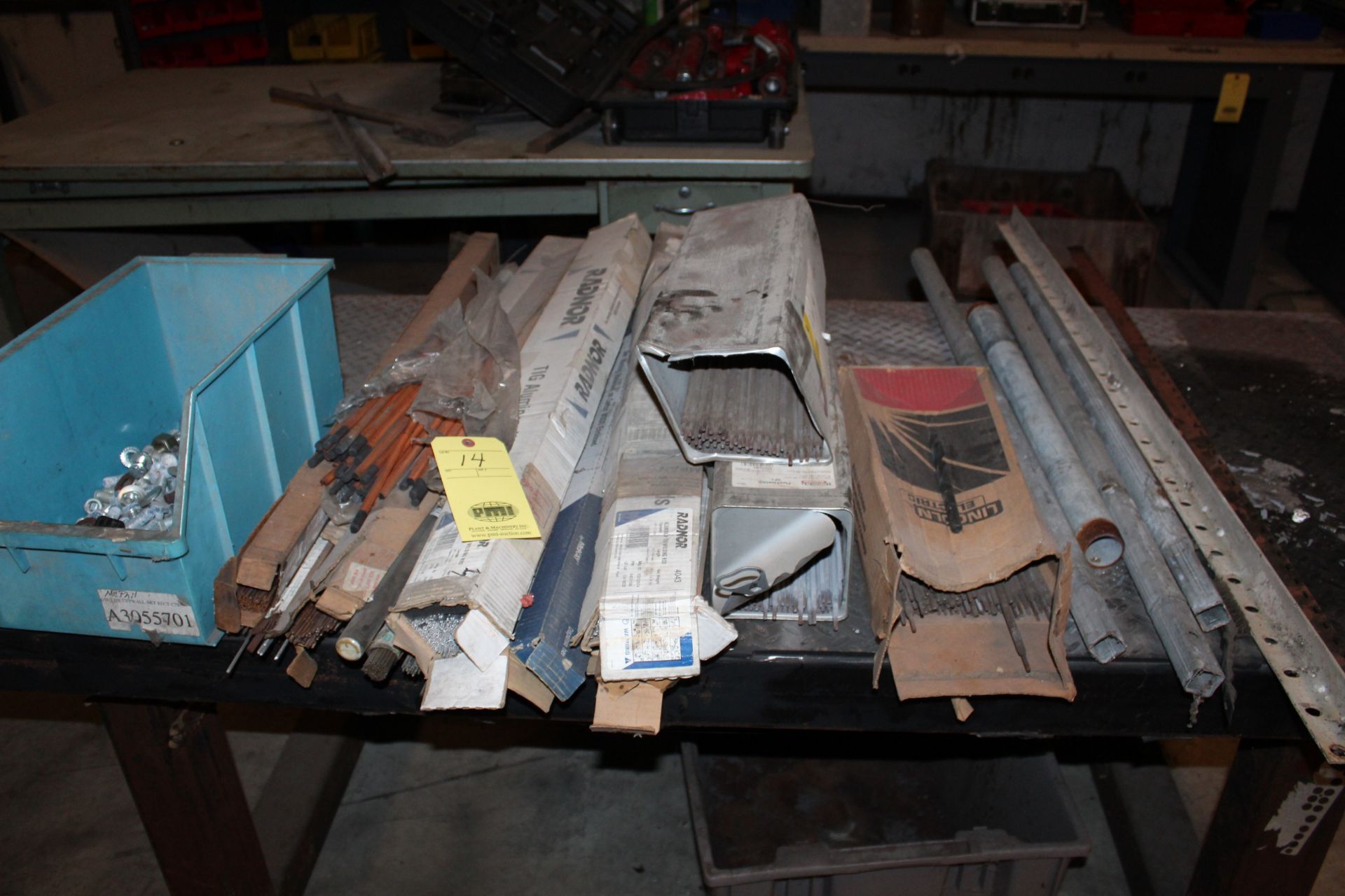 LOT CONSISTING OF: assorted welding rod, plastic bin w/nuts & bolts, pipe, angle iron (located on