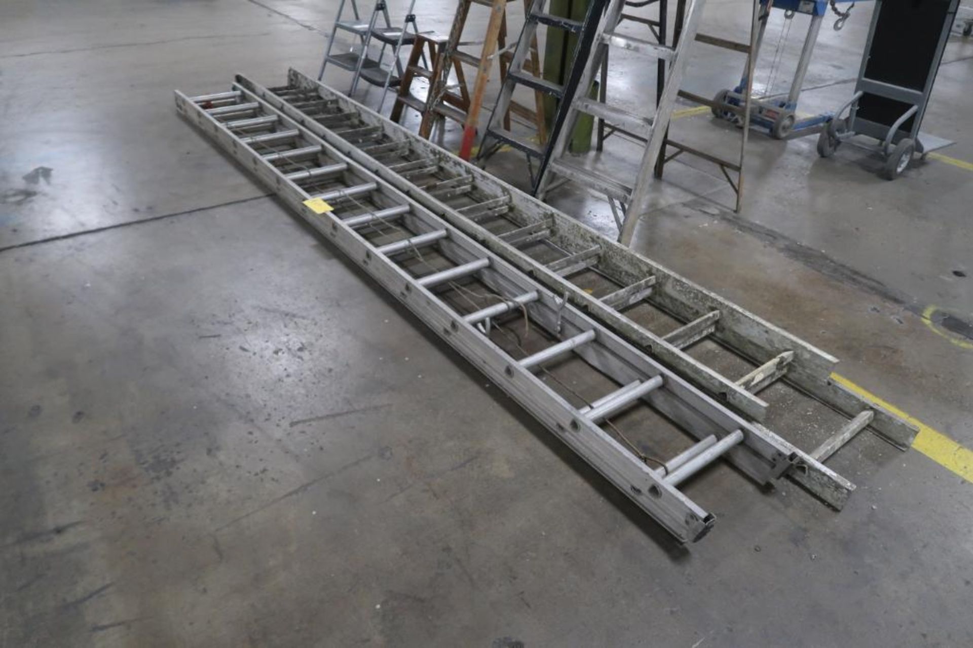 LOT: (2) 28 ft. Aluminum Extension Ladders, LOCATION: MAIN PRESS FLOOR