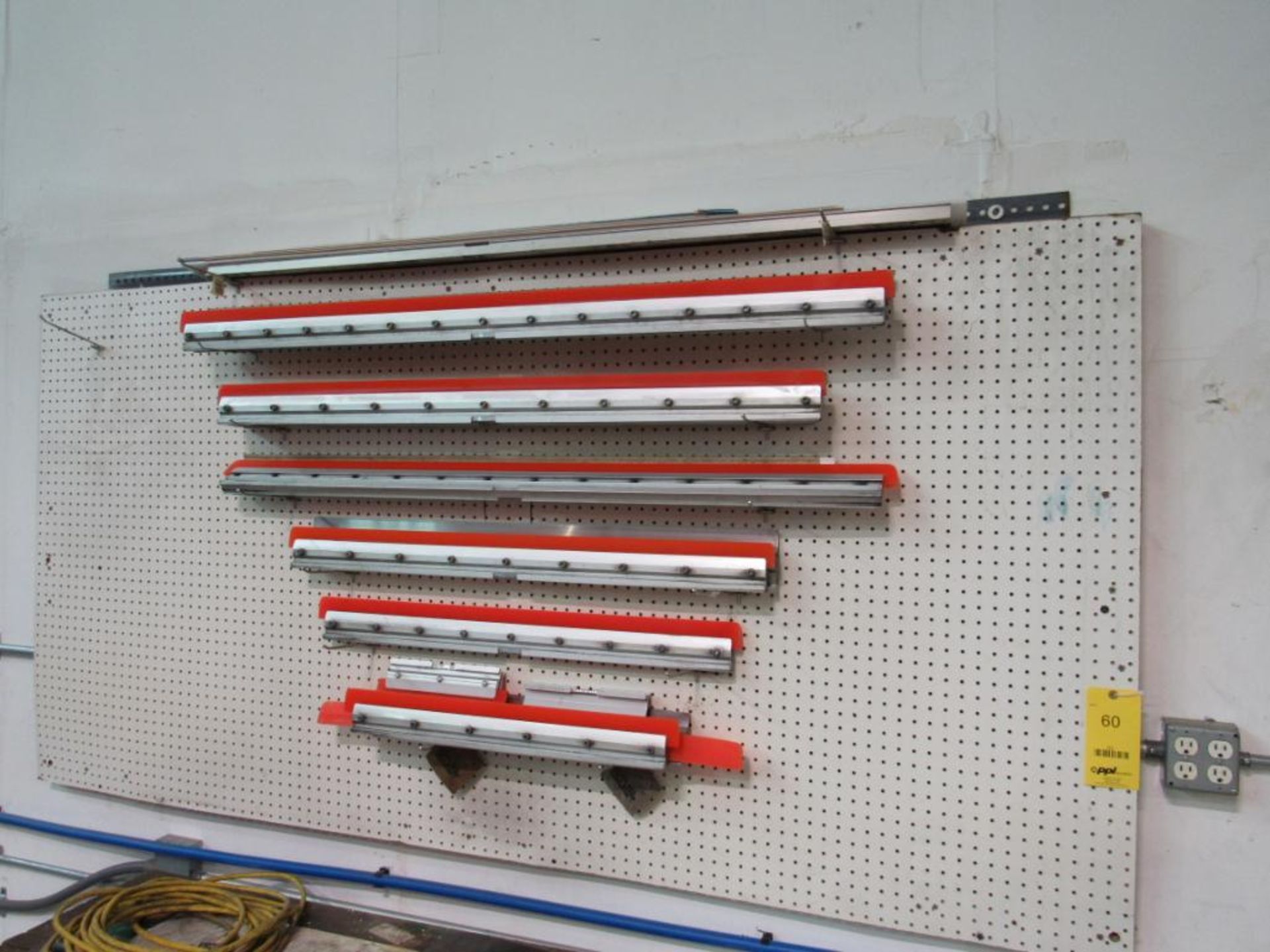 LOT: Assorted Squeegee's on Peg Board on Wall