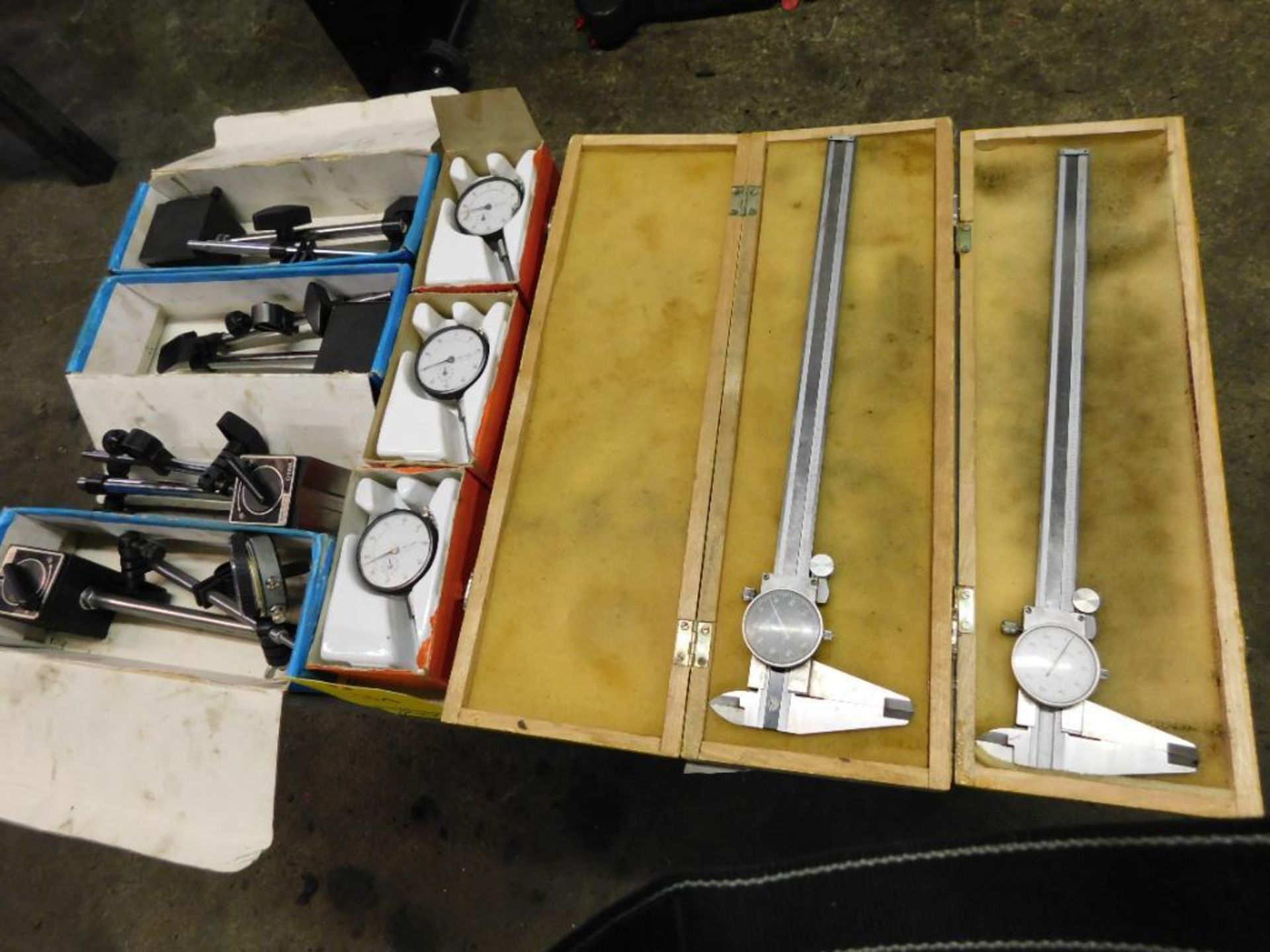 LOT: (2) 12 in. Dial Calipers, (4) Magnetic Indicator Stands (LOCATION: 520 DRESDEN ST., KALKASKA,