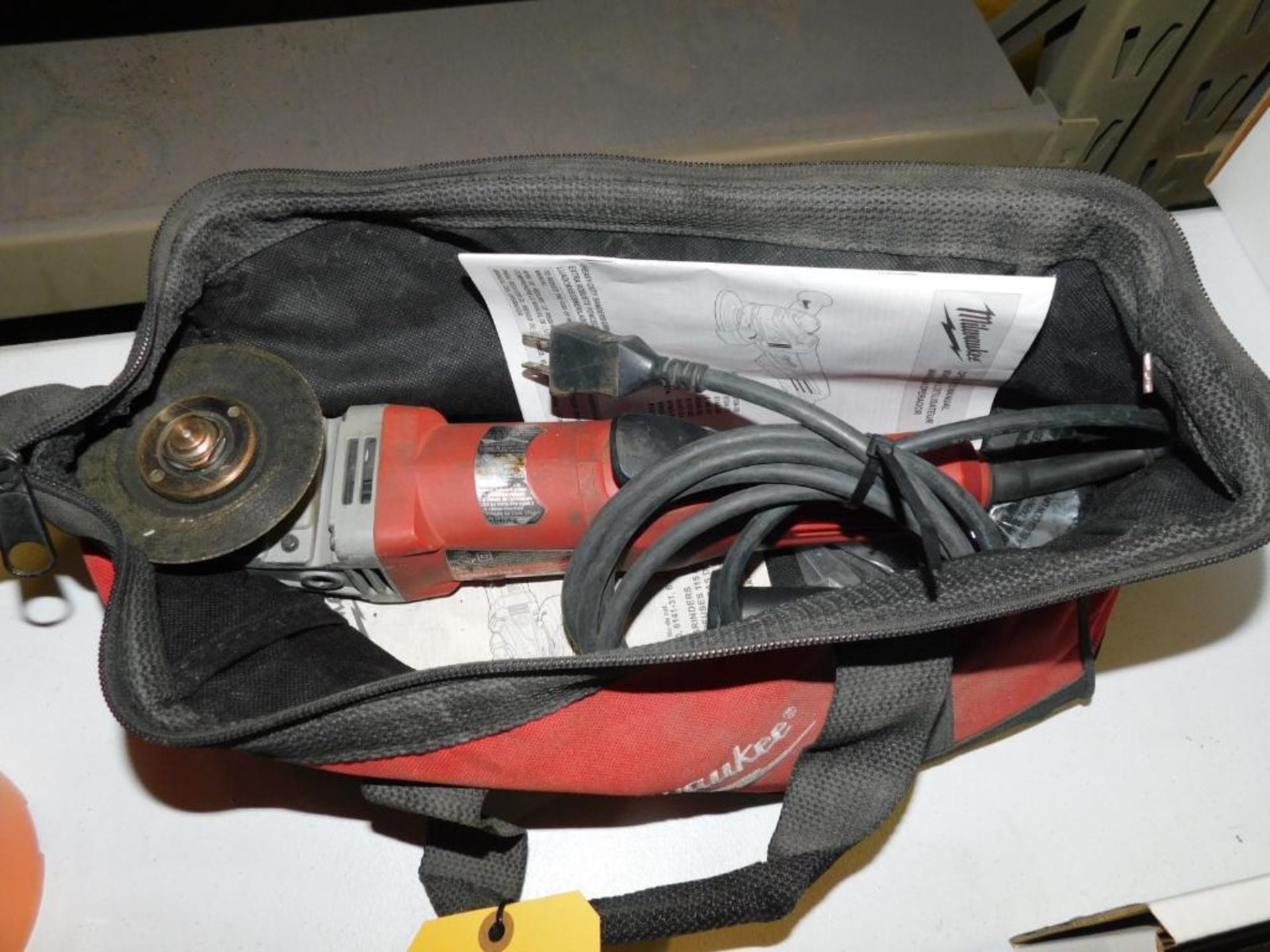 LOT: Milwaukee 4-1/2 in. Angle Grinder, with Bag & Cutting Discs