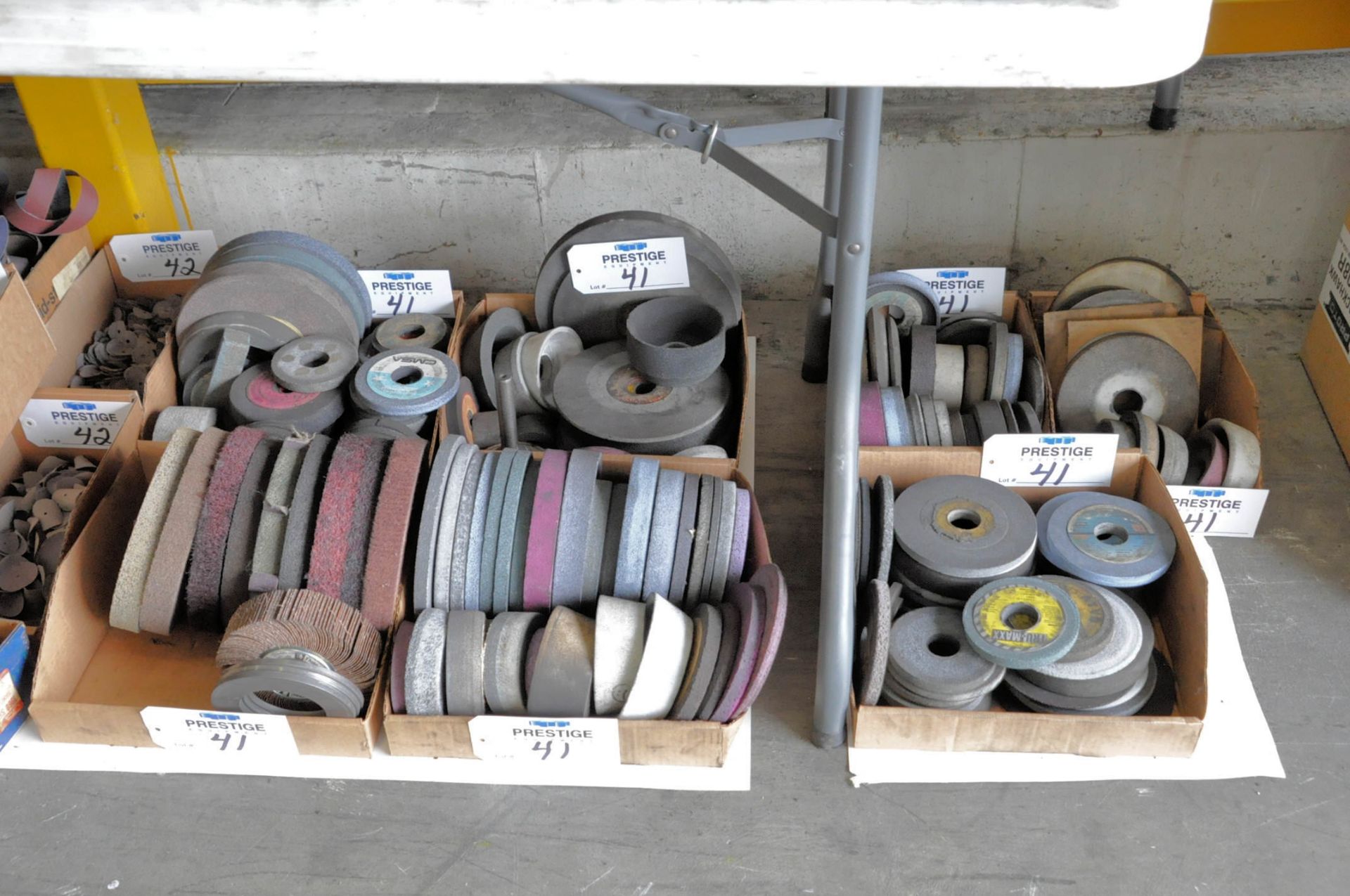 Lot-Used Grinding Wheels in (7) Boxes Under (1) Table, (Bldg 1)