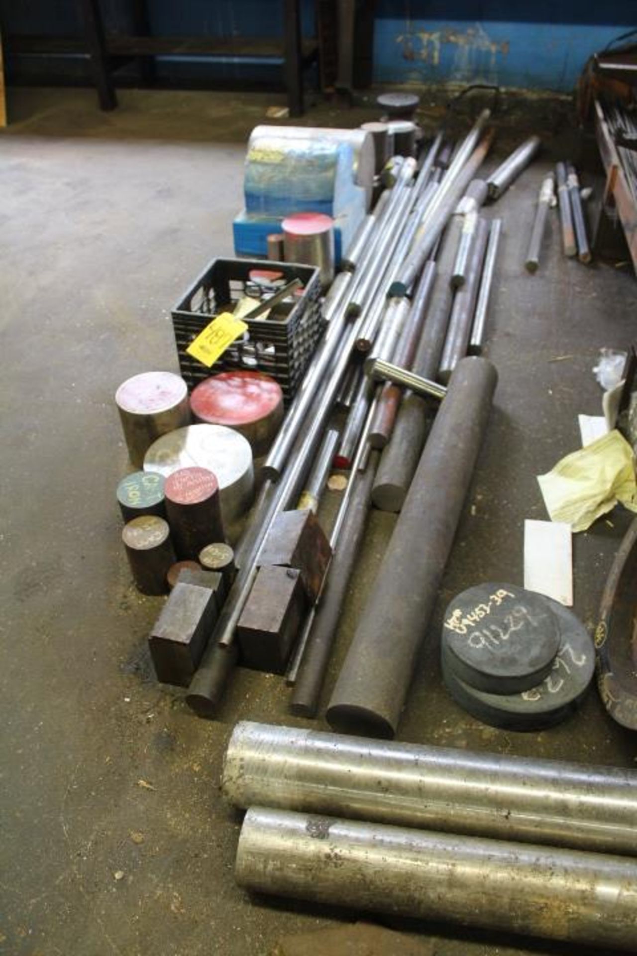 STEEL MATERIAL ON GROUND, BY WALL, ON BENCH AND RACKS OF LOTS 485 AND 486