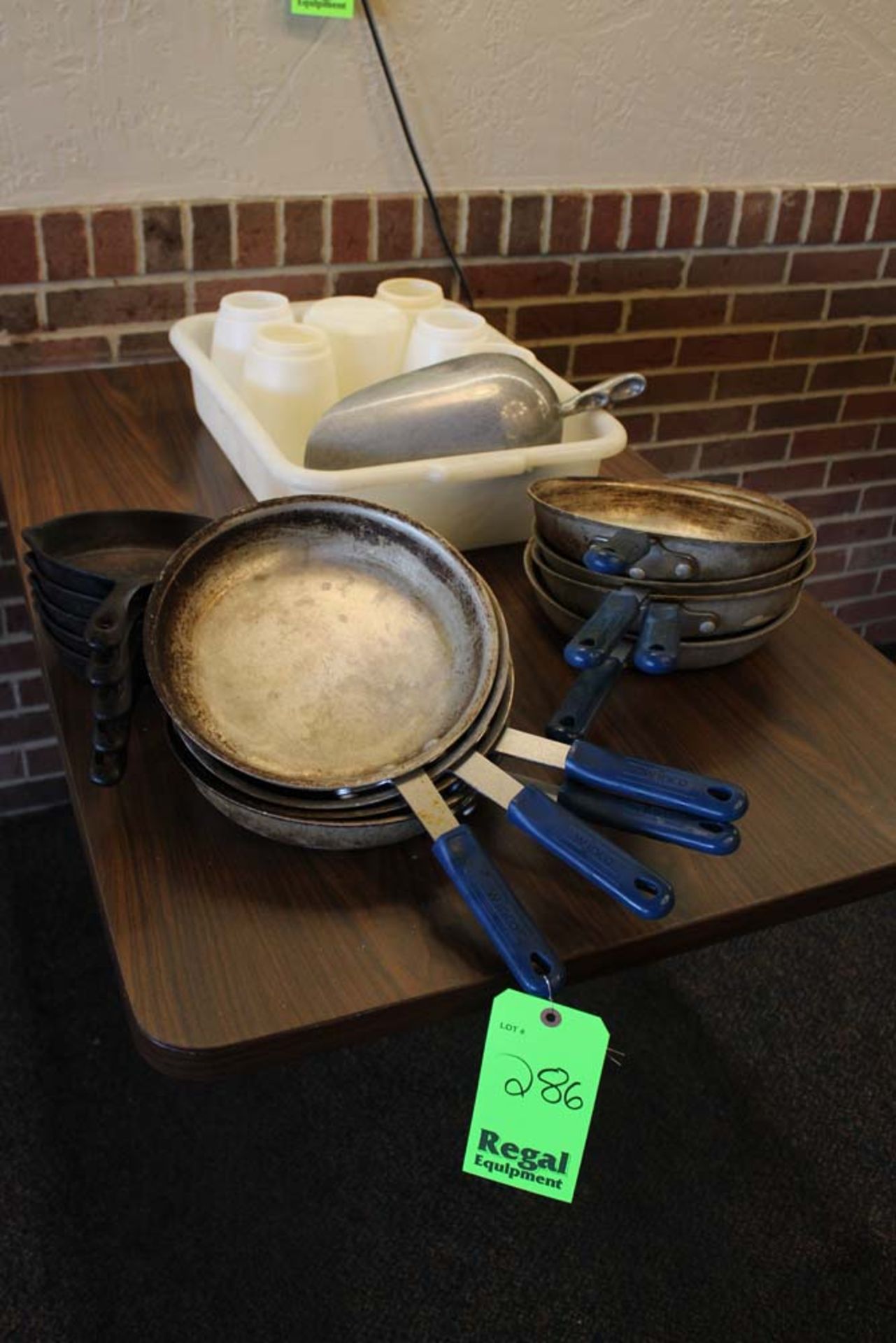 (5) 7" Cast Iron Skillets, (8) Winco AFP-10A+H Skillets, Plastic Bin with Ice Scoop and (6)