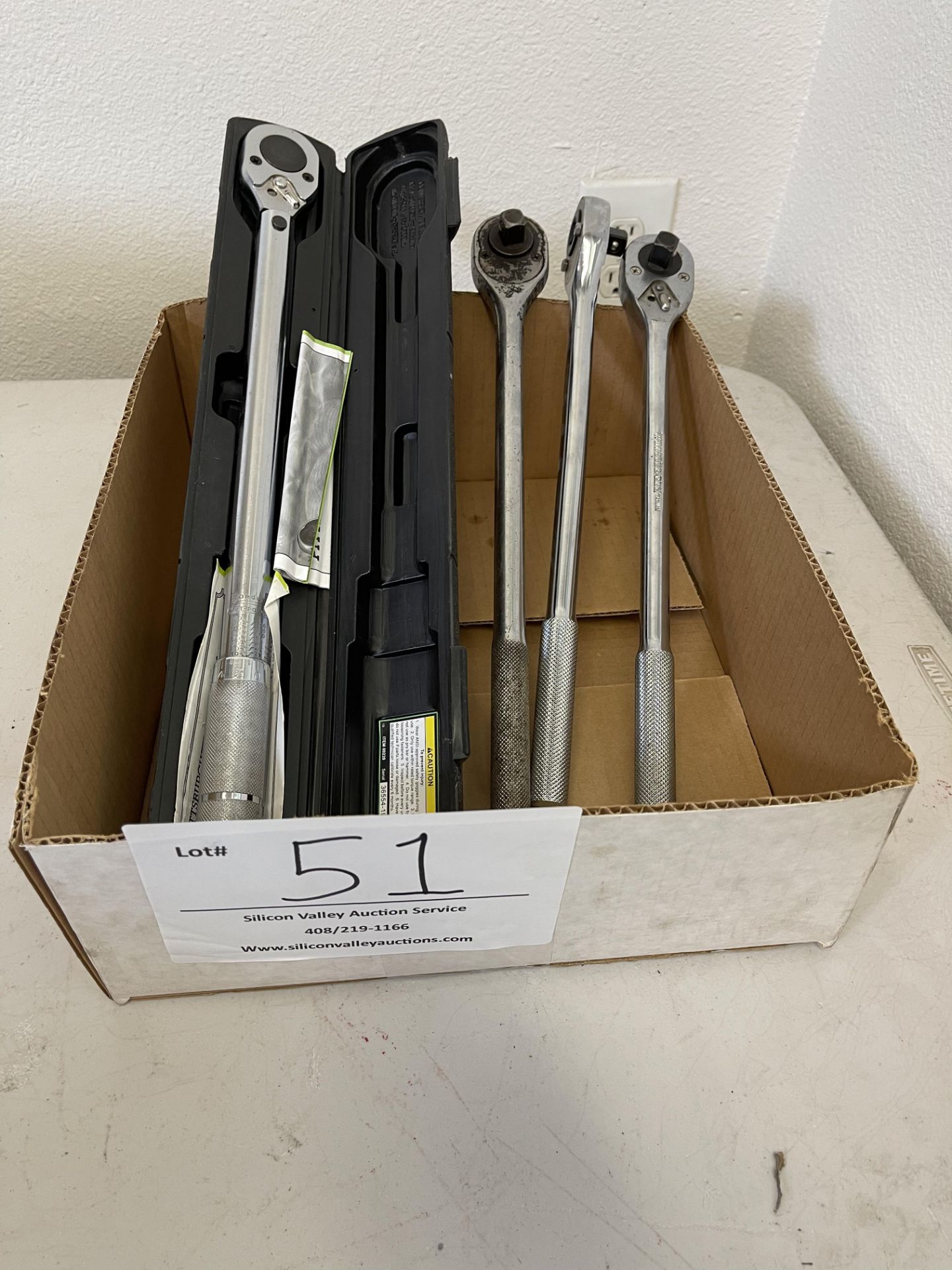 Various socket wrenches, one torque wrench