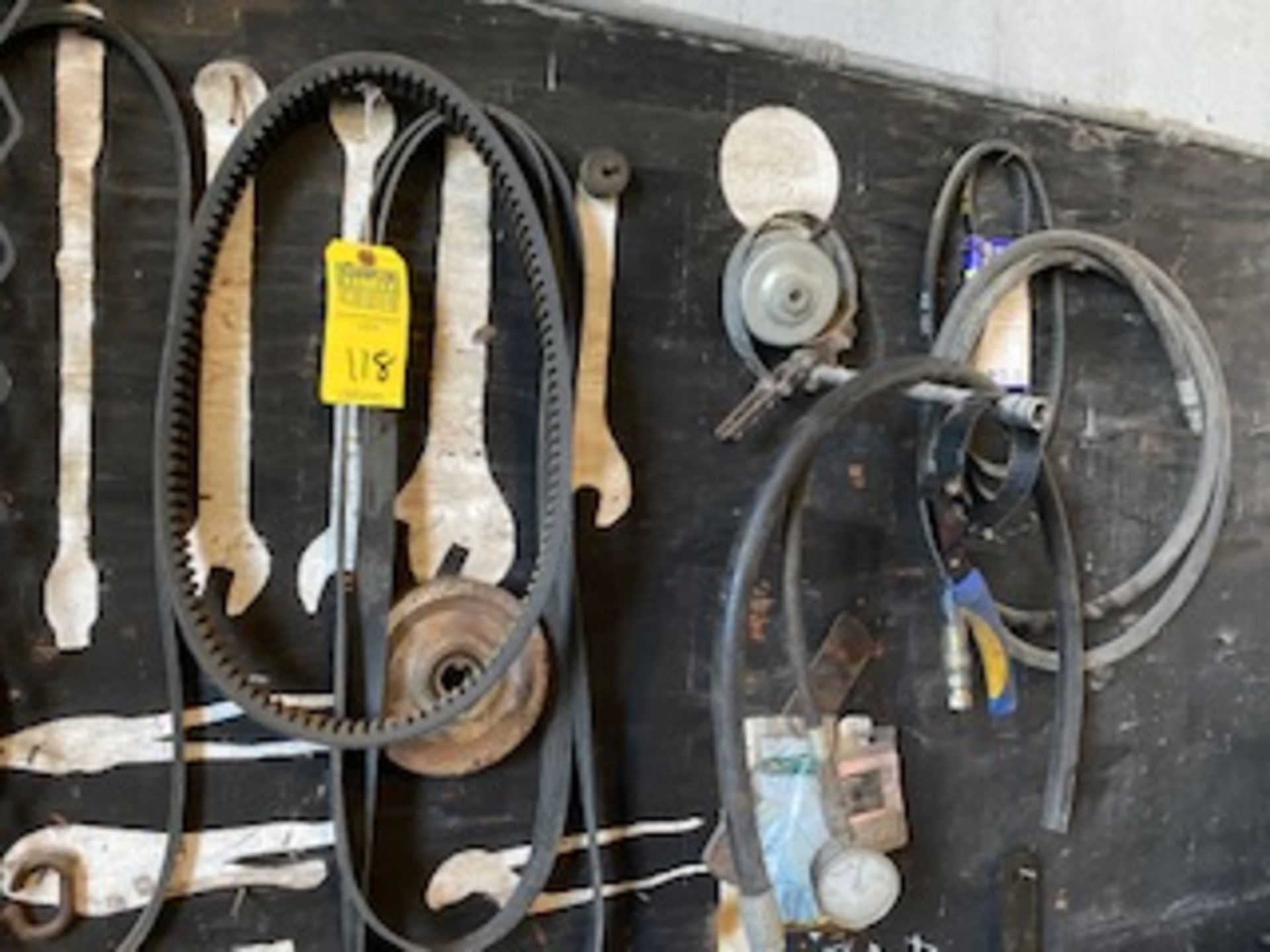 LOT TOOLS, BELTS, WELDING APRONS, ETC - CONTENTS OF BOARD & 3 WELDERS JACKETS ON WALL