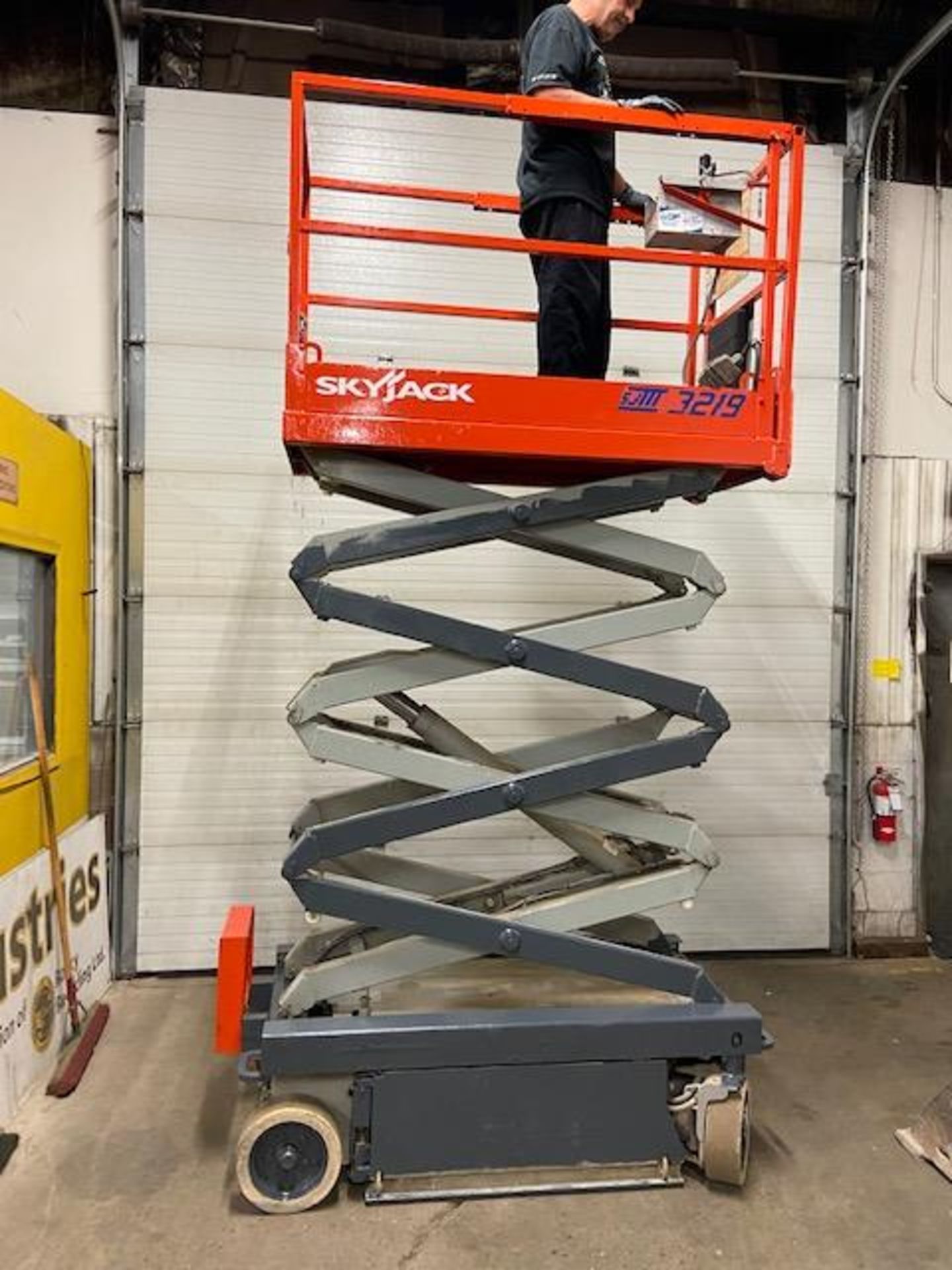 SkyJack III Electric Scissor Lift model 3219 - 19 feet lift, 32 inch width deck with pendant