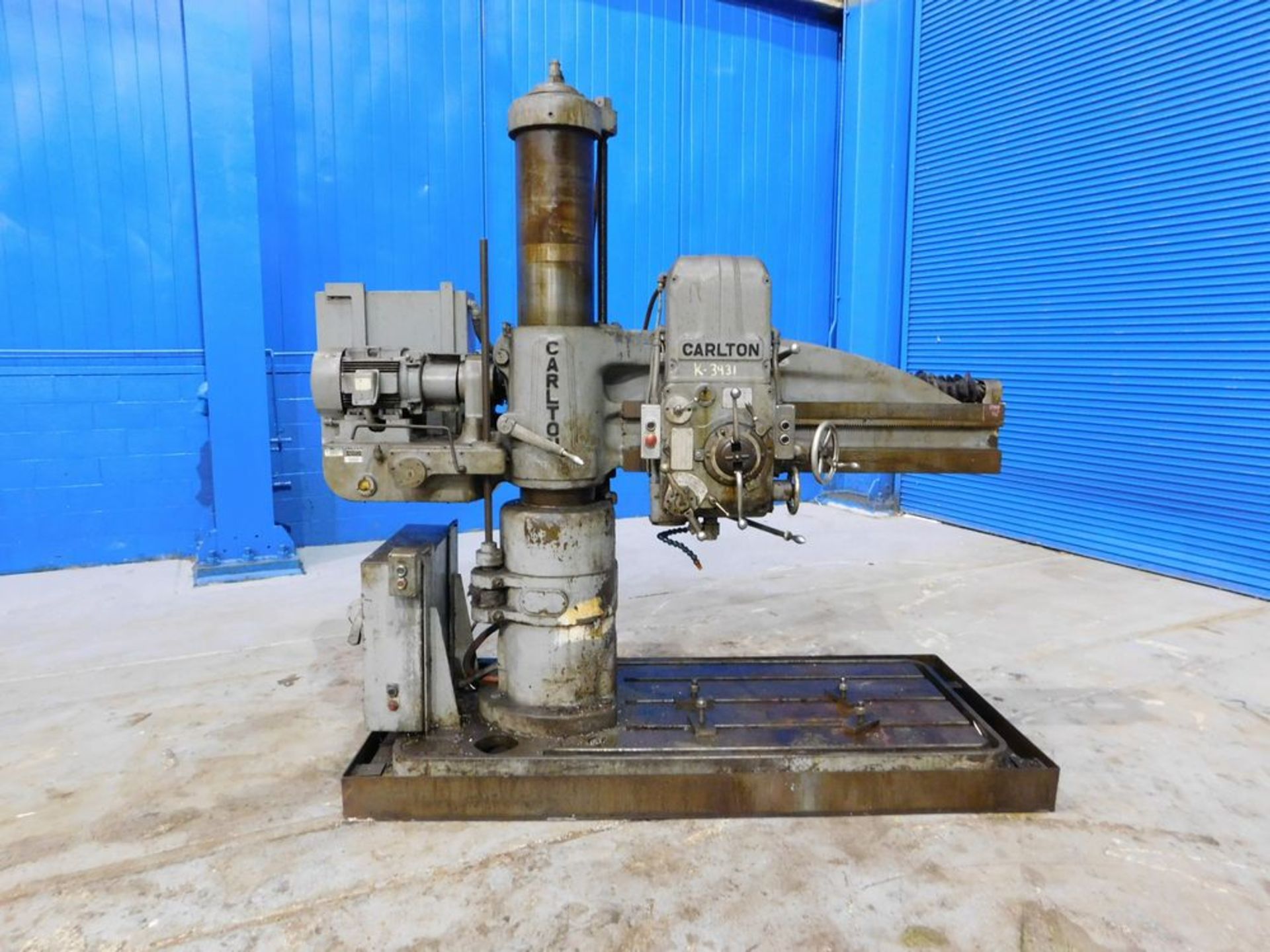 Carlton Radial Arm Drill 4' x 9''. LOADING FEE FOR THIS LOT: $500