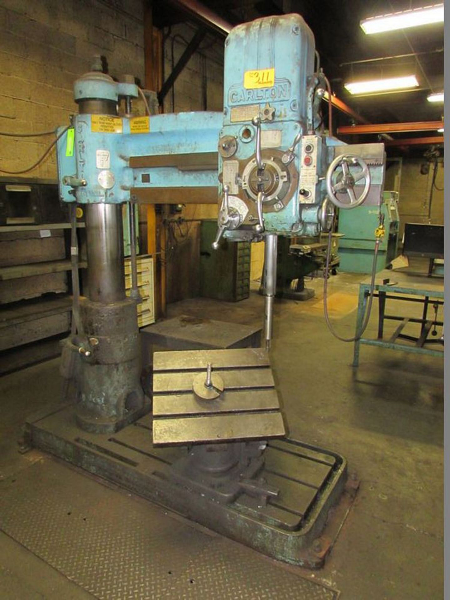 Carlton Radial Arm Drill 4' x 9''. LOADING FEE FOR THIS LOT: $500