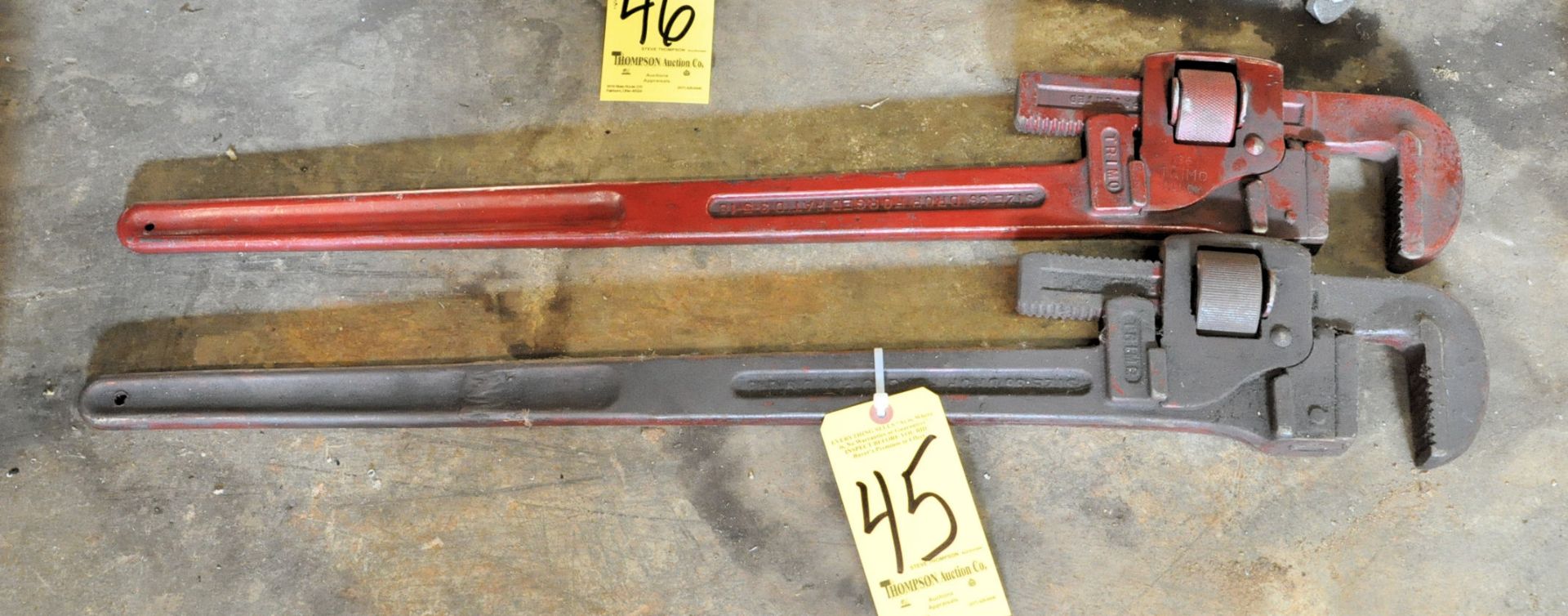 (2) 36" Pipe Wrenches Under (1) Bench