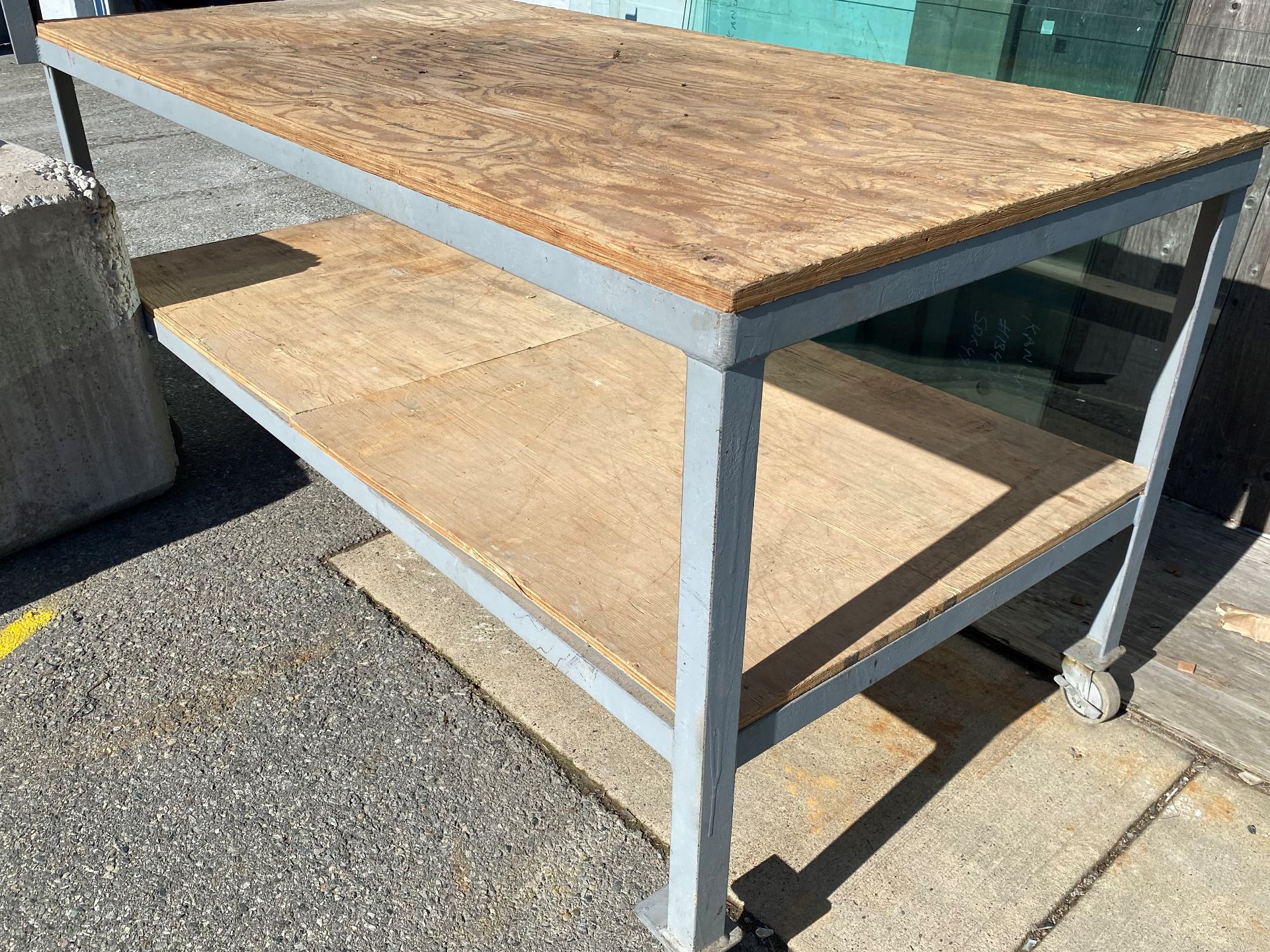 STEEL FRAMED TABLE ON CASTORS