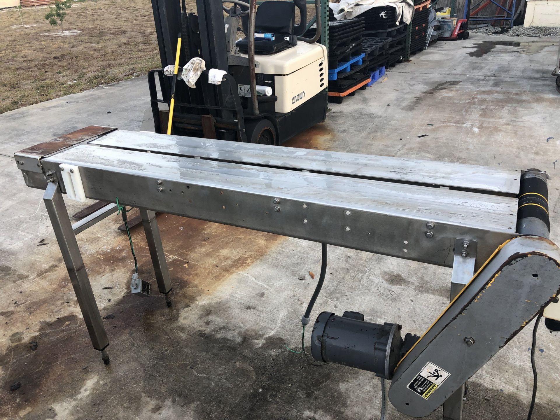 12" wide x 6-ft long stainless steel conveyor without belt. Loading is free. Skidding or crating