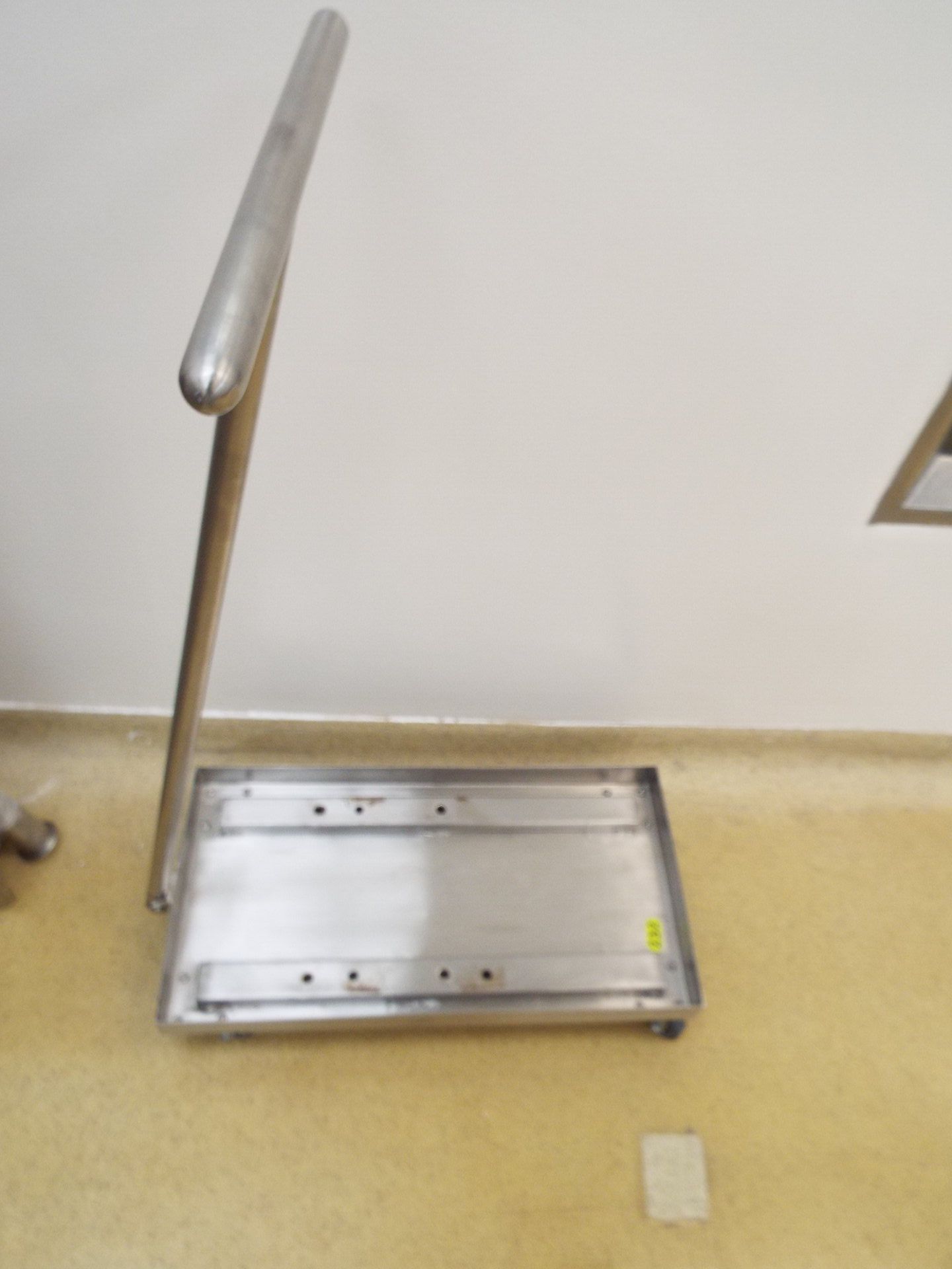Stainless steel cart on casters with pushing arm