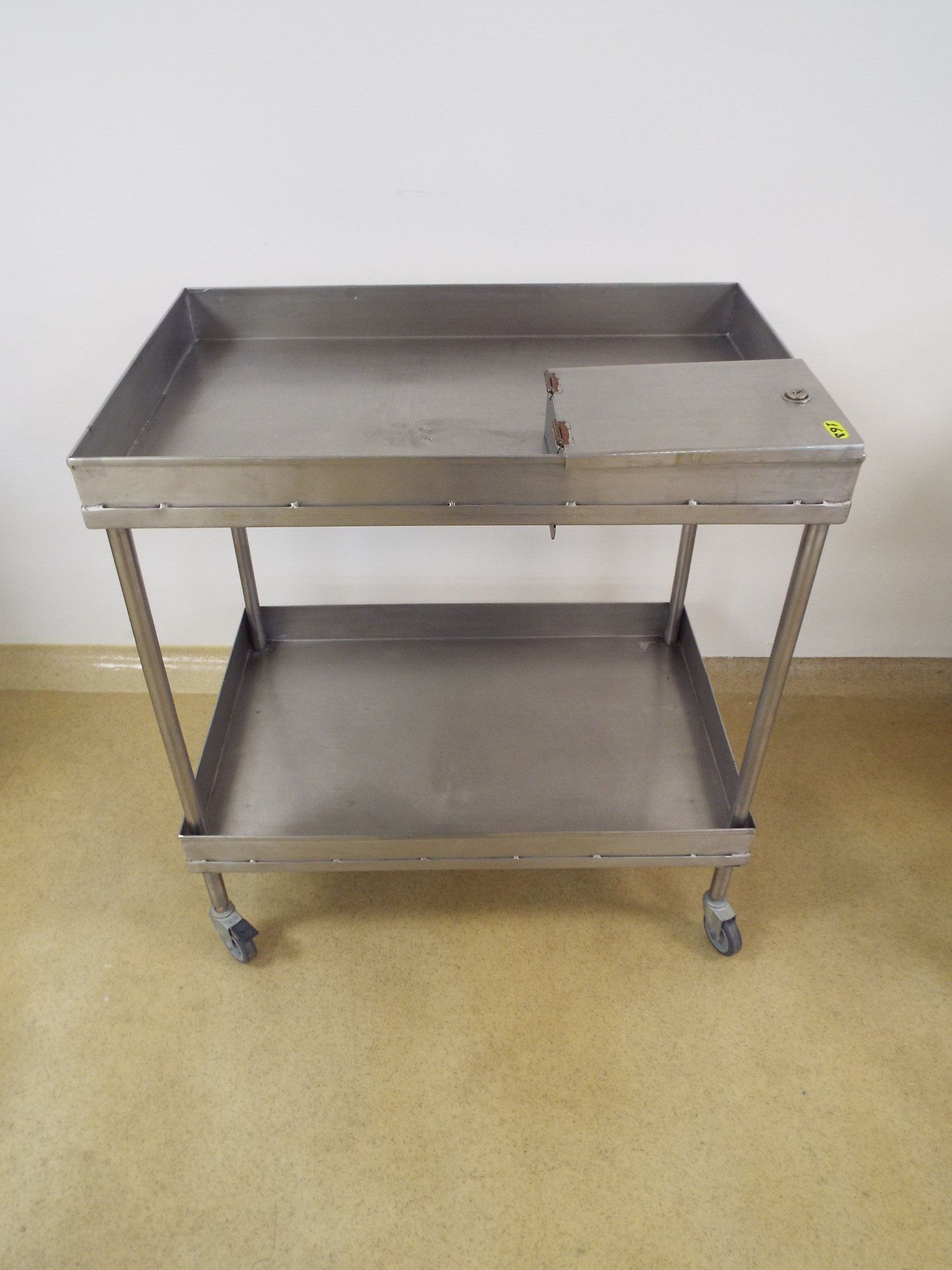 Stainless Steel cart with 2 shelves and one keyed compartment on top