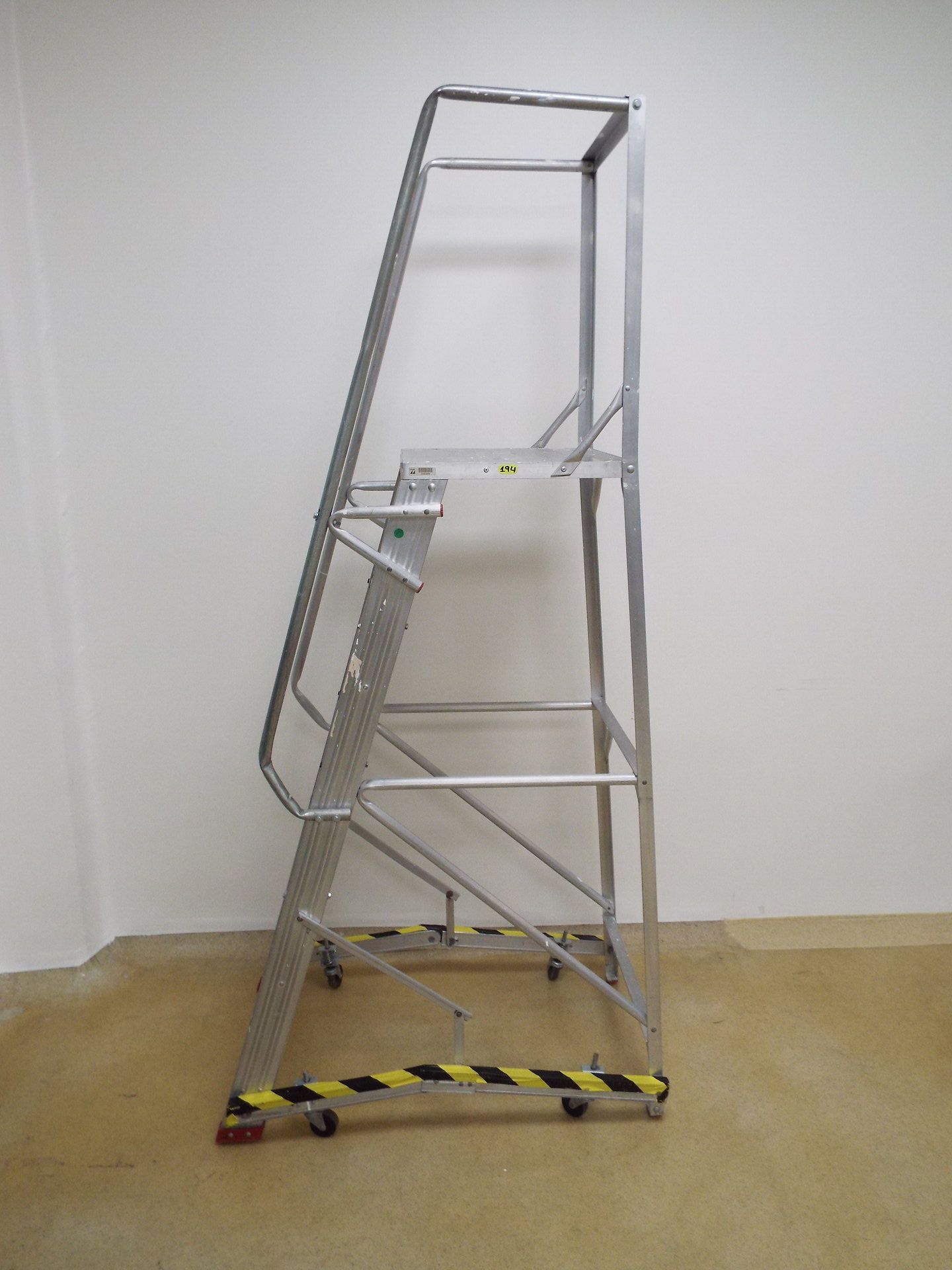 (2) Aluminum ladders on casters with handrail