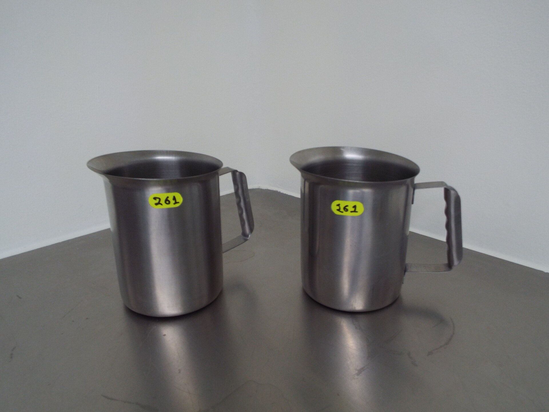 (2) stainless steel jugs