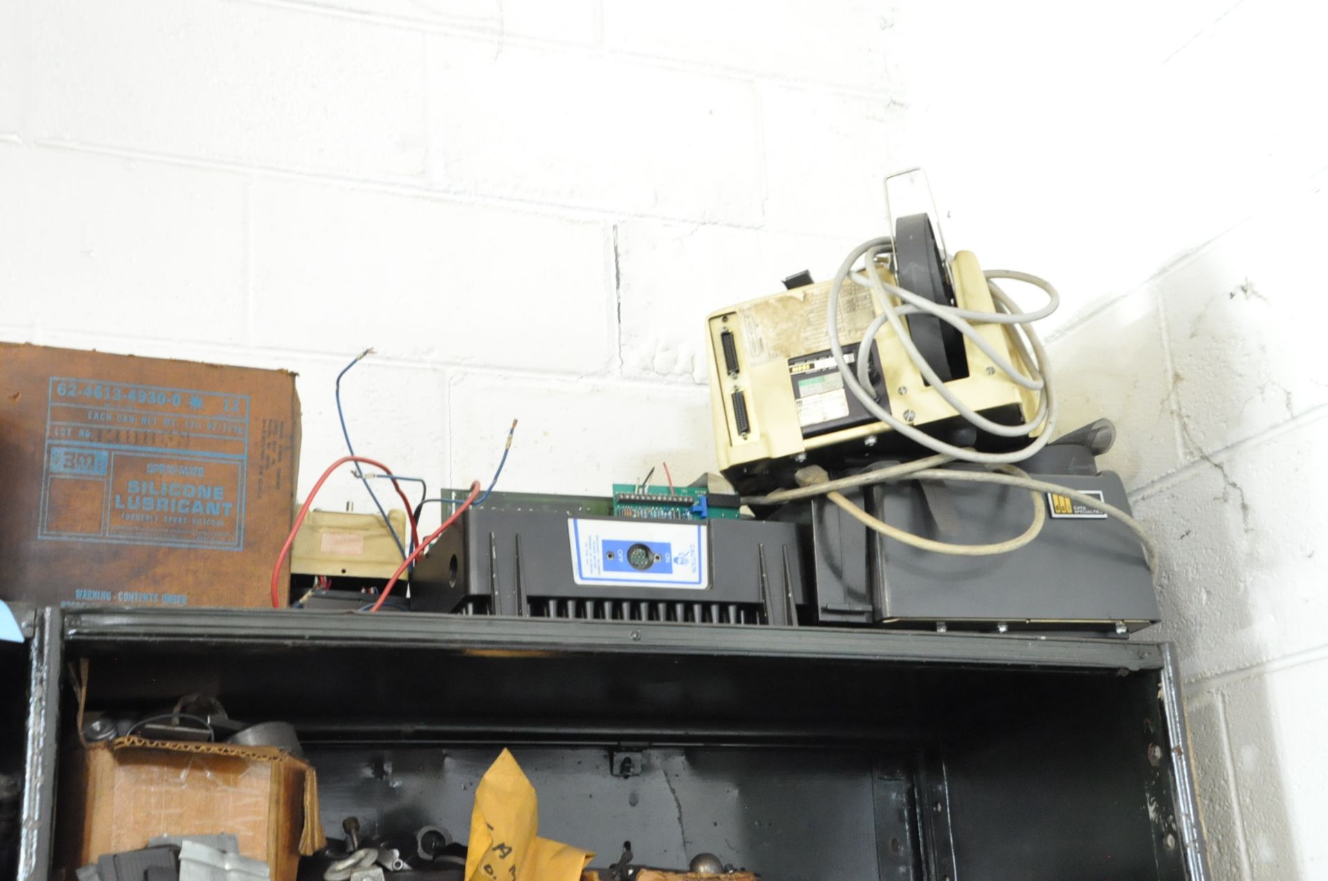 Lot-Machine Maintenance Parts on Top of Shelving