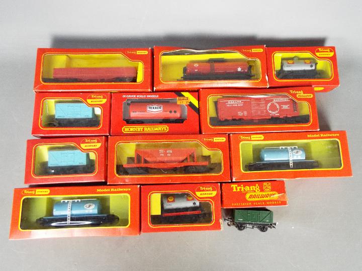 Triang Hornby - 12 boxed items of OO gauge freight rolling stock.