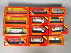 Triang Hornby - 12 boxed items of OO gauge freight rolling stock.