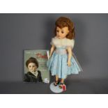 Ideal - A 20" Revlon doll by Ideal 1950's VT20 Brunette rooted doll with hairnet in original outfit,