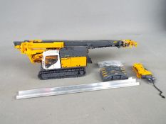 BYMO - A boxed 1:50 scale diecast BYMO #25028 Bauer RG 21 T Pile Driver with Telescopic Leader .