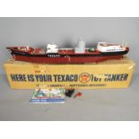 Texaco - A boxed battery operated Texaco toy tanker.