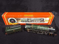 Hornby - A boxed OO gauge R303 Class 9F steam locomotive and tender Op.No.