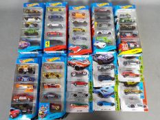 Hot Wheels - A collection of Seven 5 Car Hot Wheels packs with 11 carded Hot Wheels .