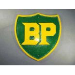 A large cast iron BP sign approximately 34 cm x 33 cm.