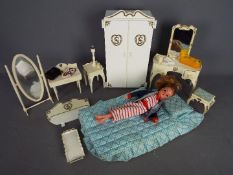 Pedigree - A vintage Pedigree Sindy doll with bedroom accessories including a bed, wardrobe,
