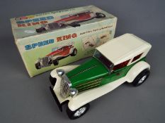 Taiyo - A boxed Japanese tinplate and plastic 'Speed King' battery operated 'Bump' N Go car.